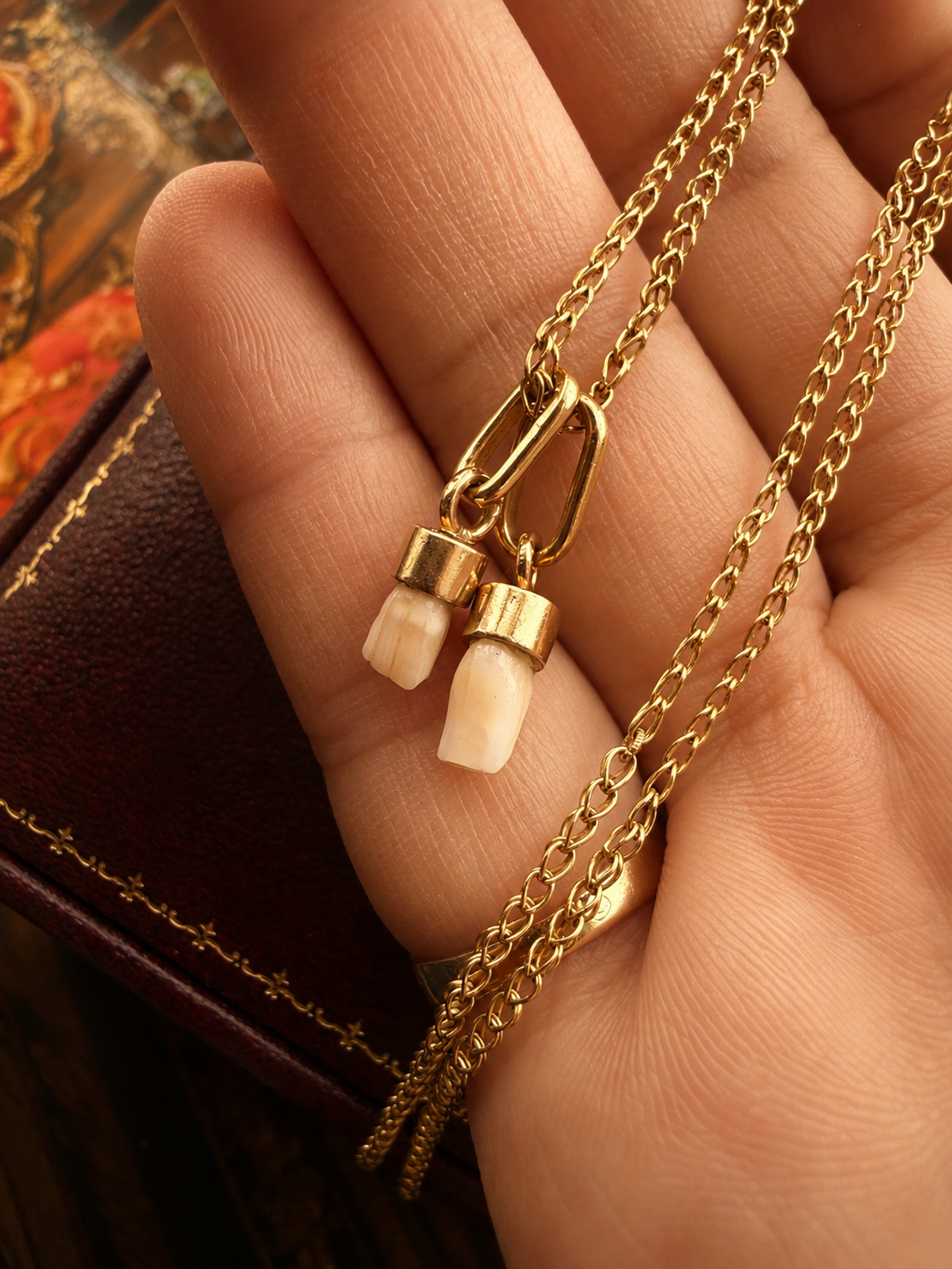 Pair of 2 Antique 18K gold milk teeth pendant