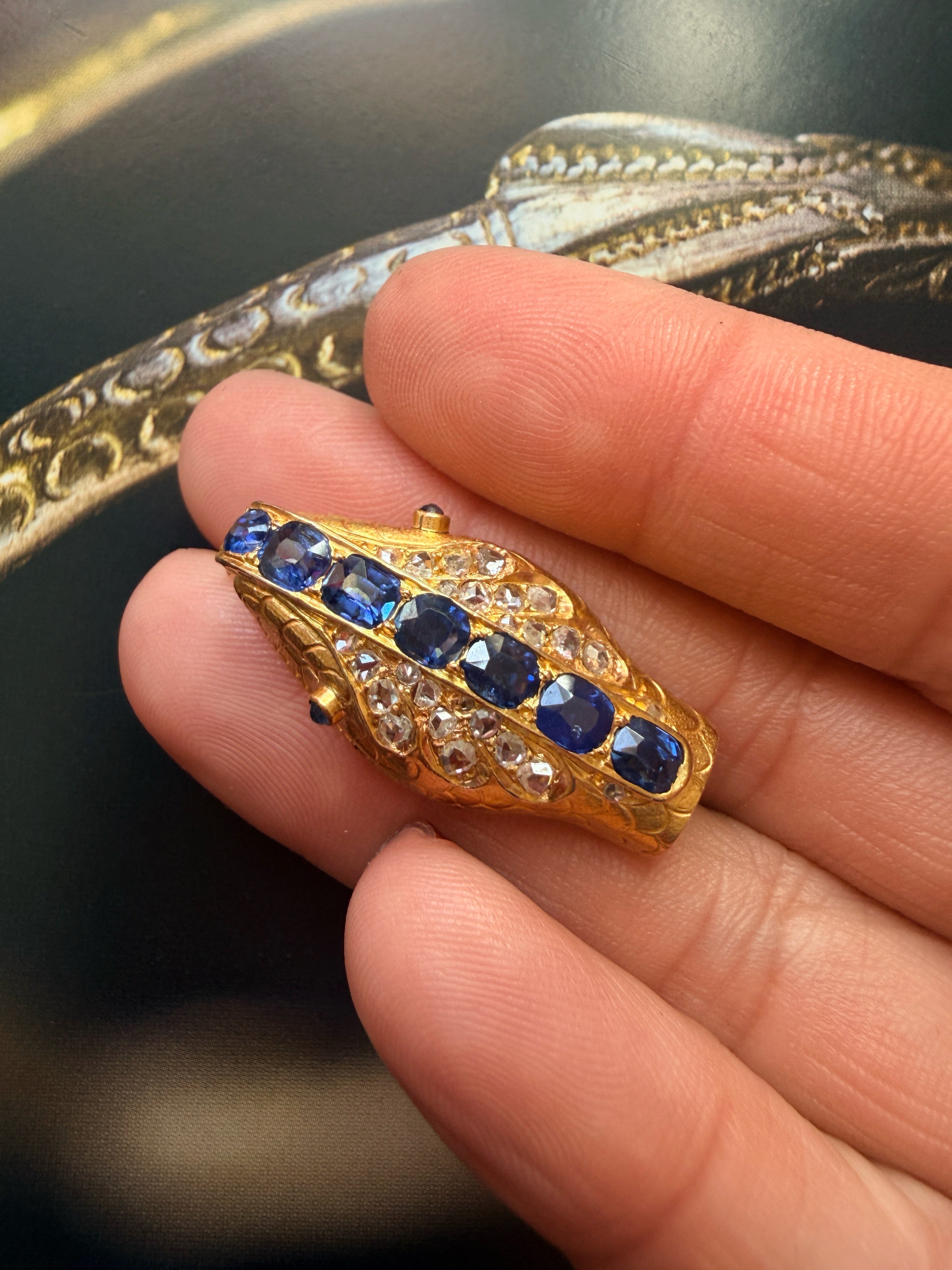 Antique 18K gold blue sapphire diamond snake head brooch