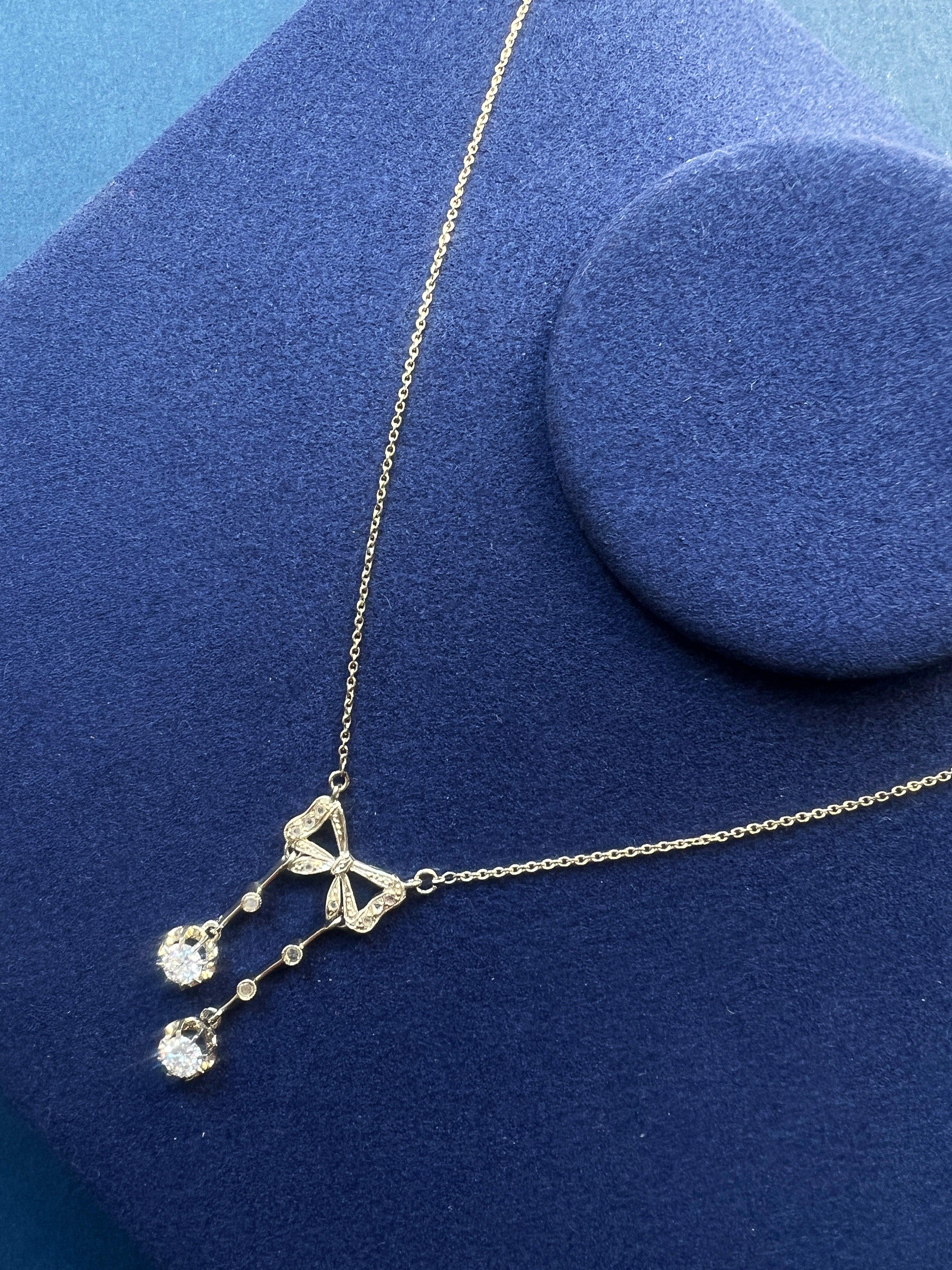 Antique French 18K white gold diamond bow negligée necklace