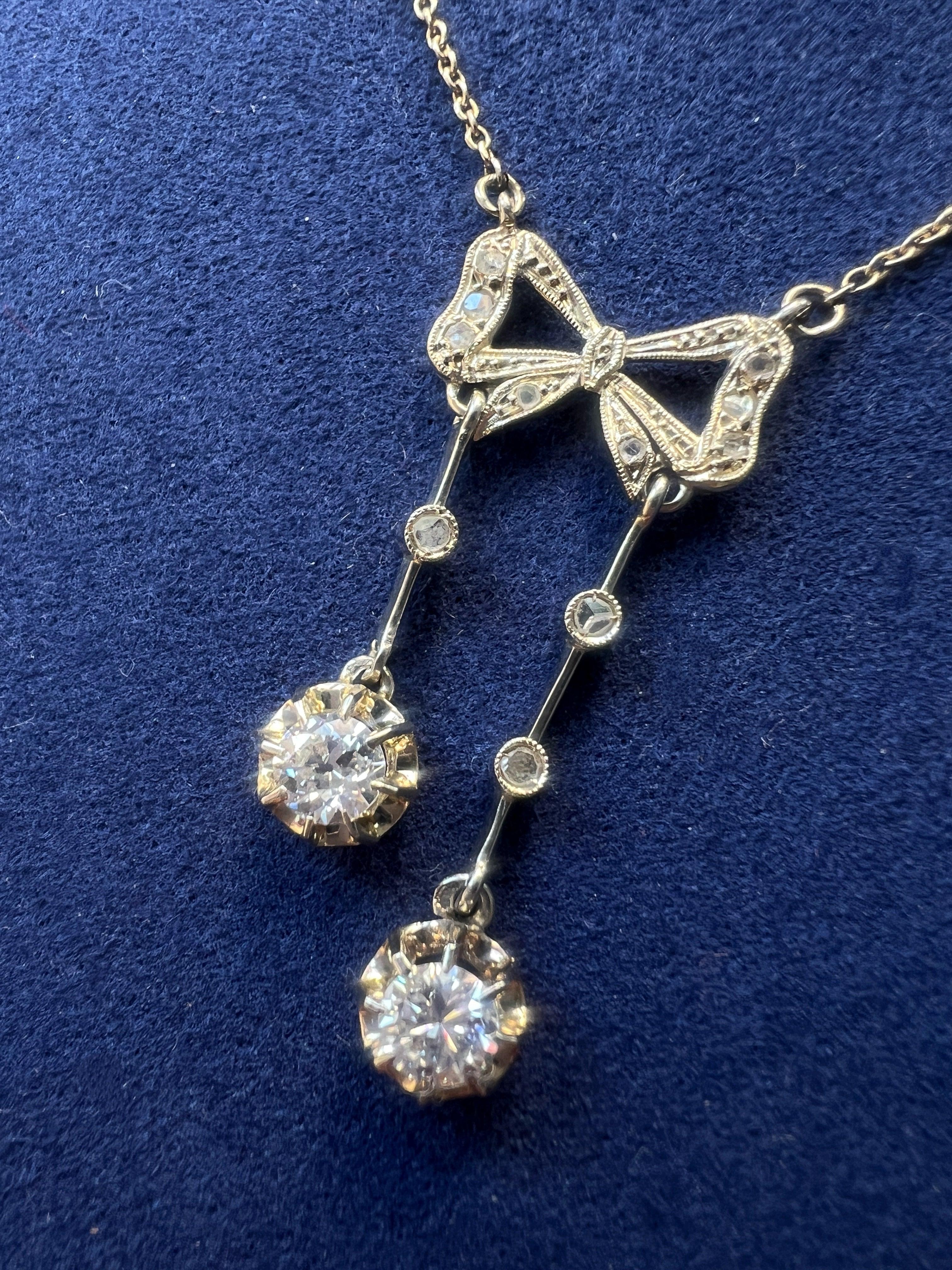 Antique French 18K white gold diamond bow negligée necklace