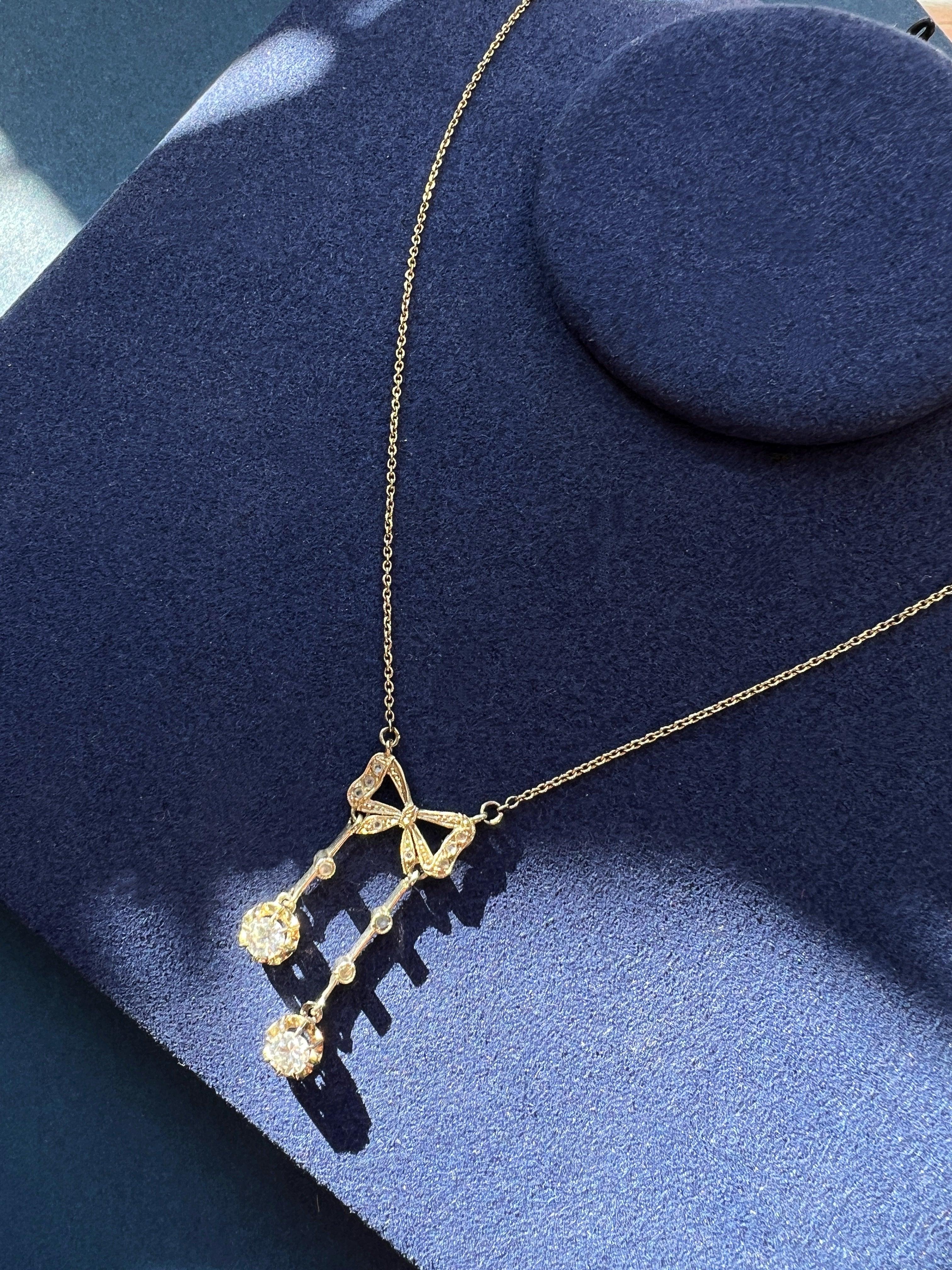 Antique French 18K white gold diamond bow negligée necklace