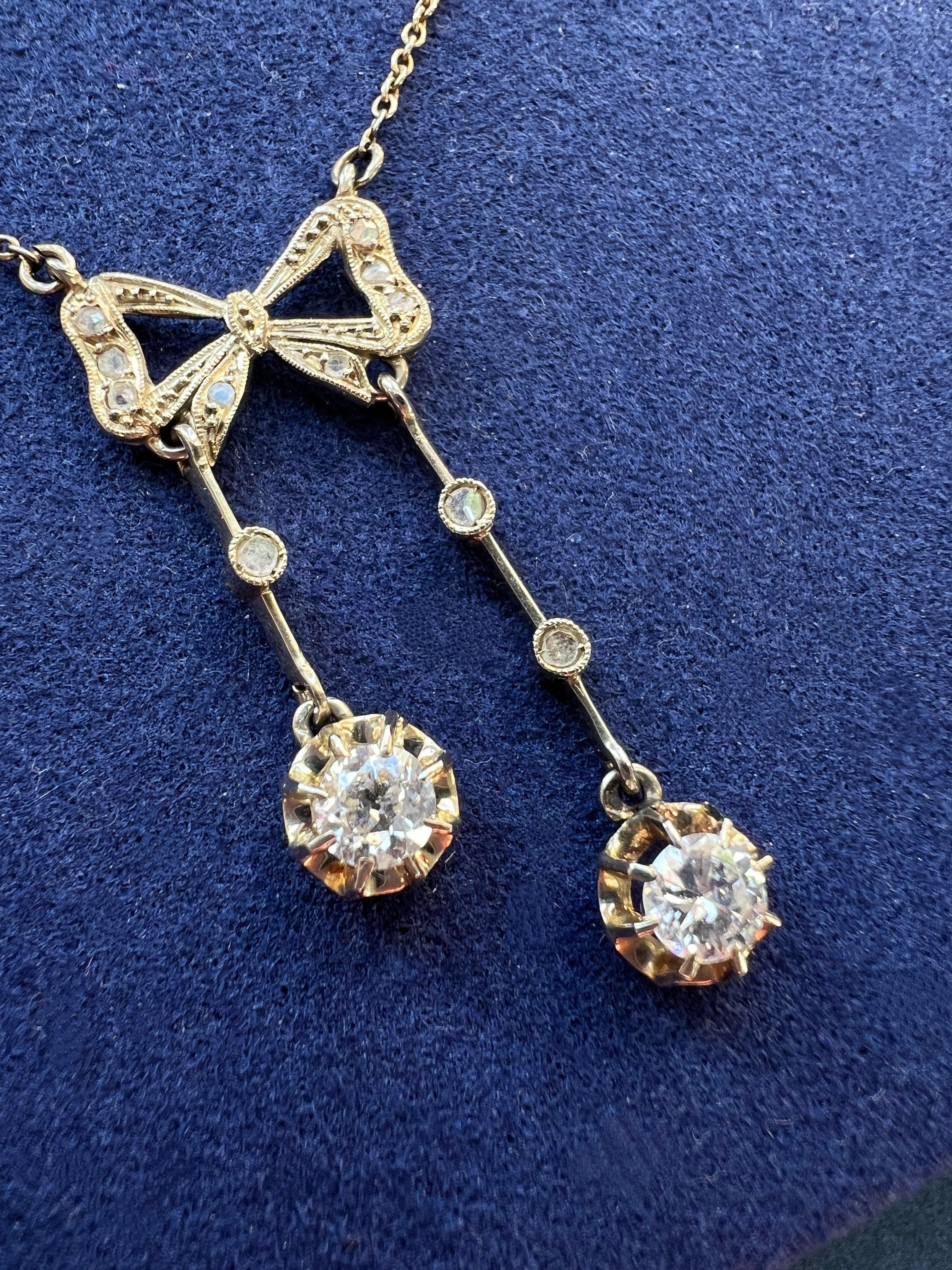 Antique French 18K white gold diamond bow negligée necklace
