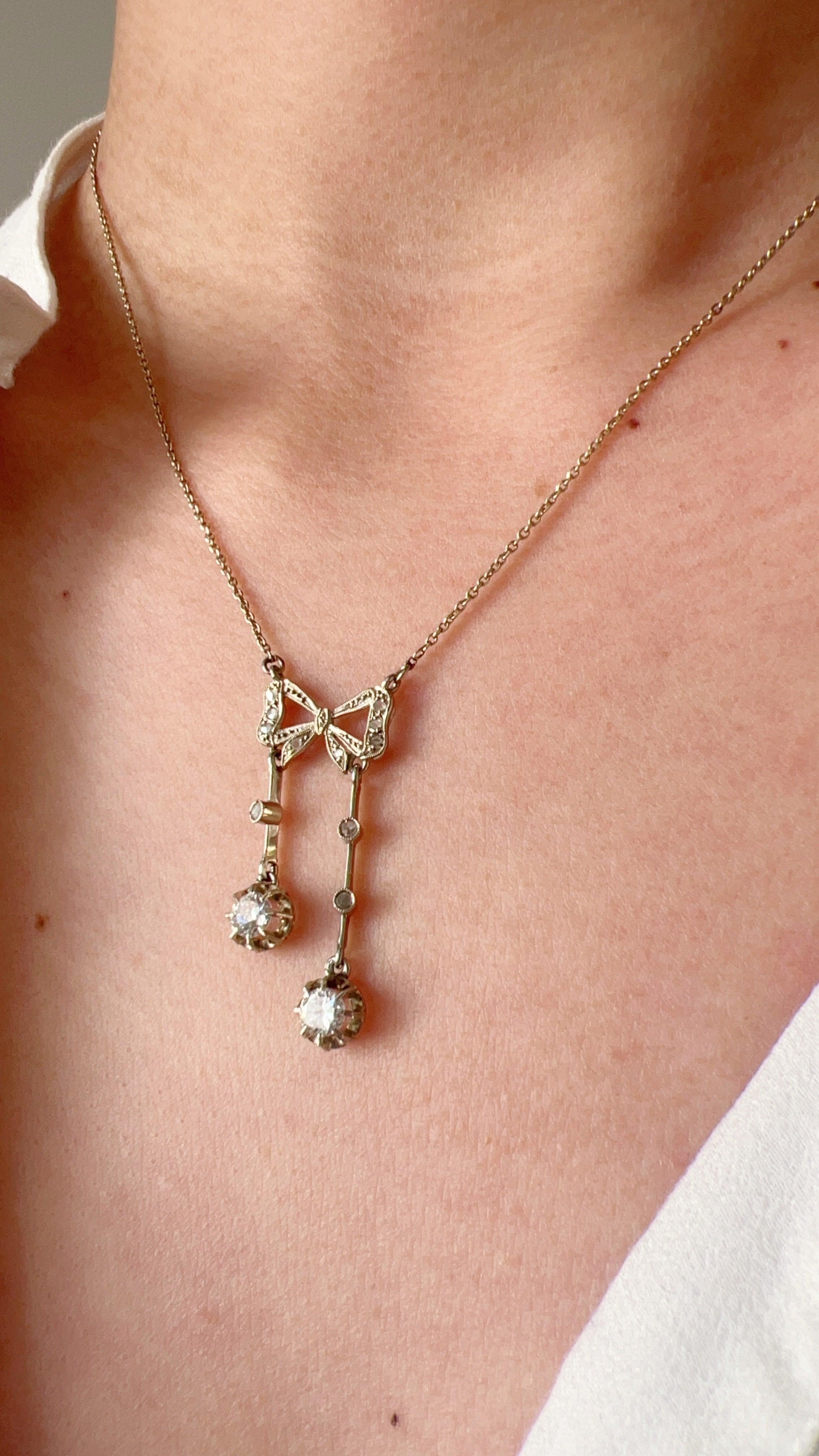 Antique French 18K white gold diamond bow negligée necklace