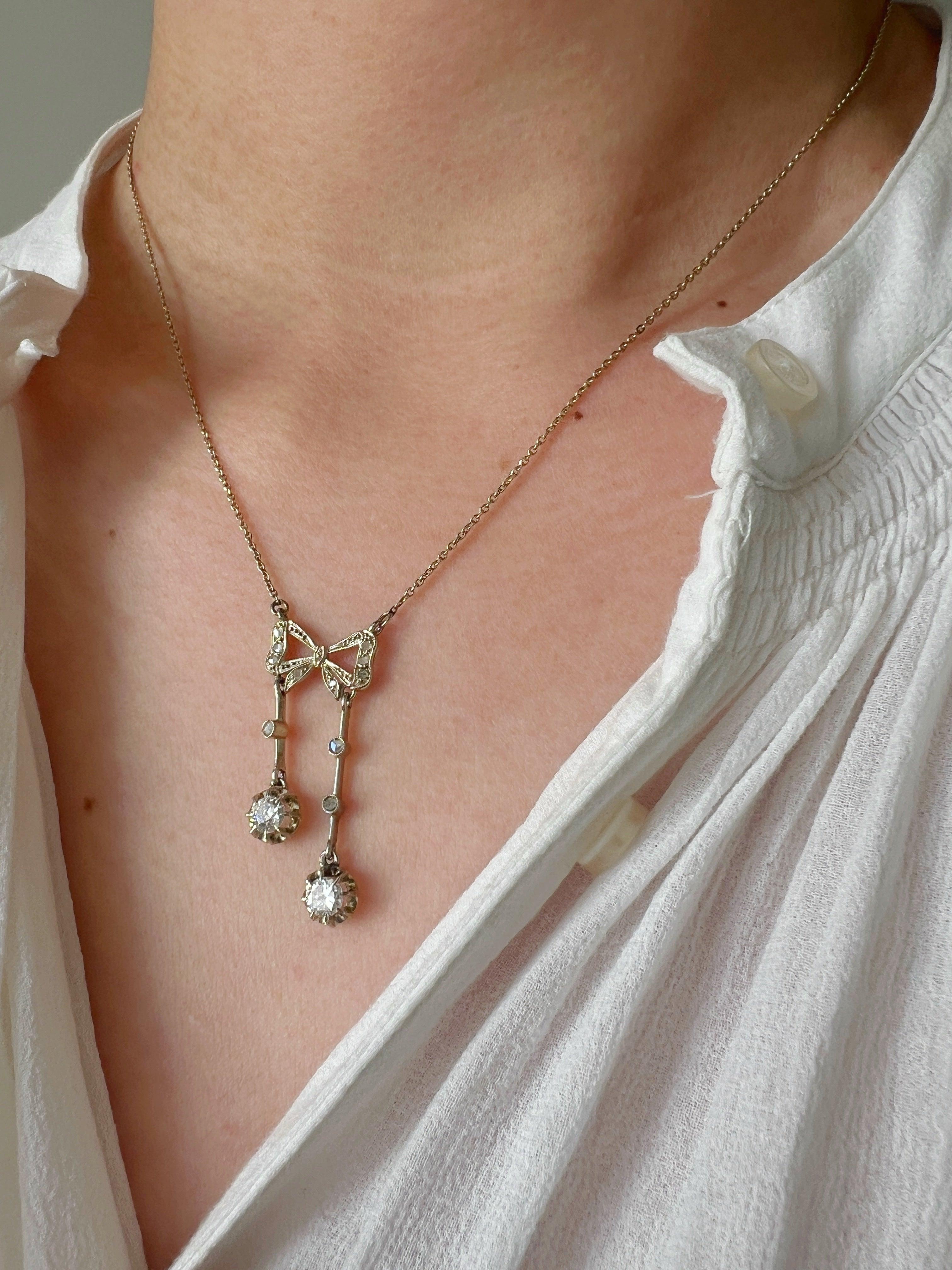 Antique French 18K white gold diamond bow negligée necklace