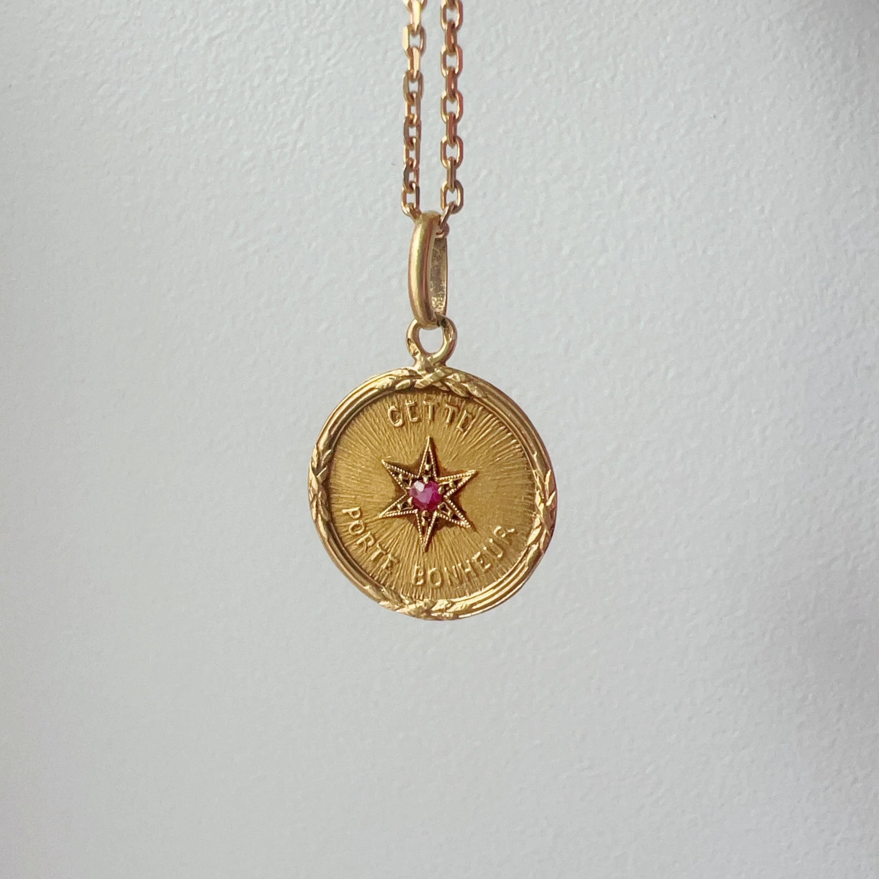 Rare French antique 18K ruby star medal pendant “this star brings happiness” - Curiously timeless