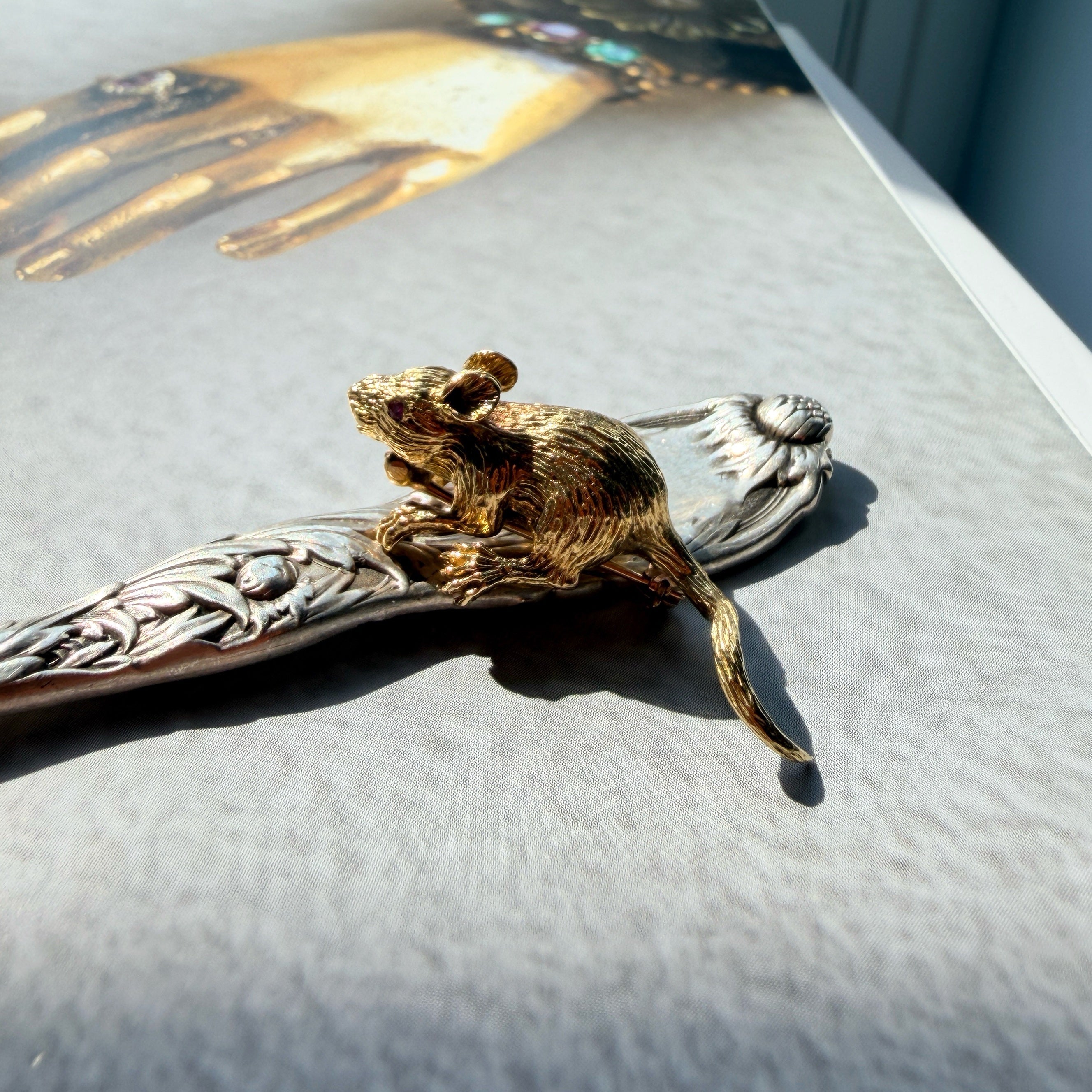 Vintage 18K yellow gold mouse brooch with ruby eyes