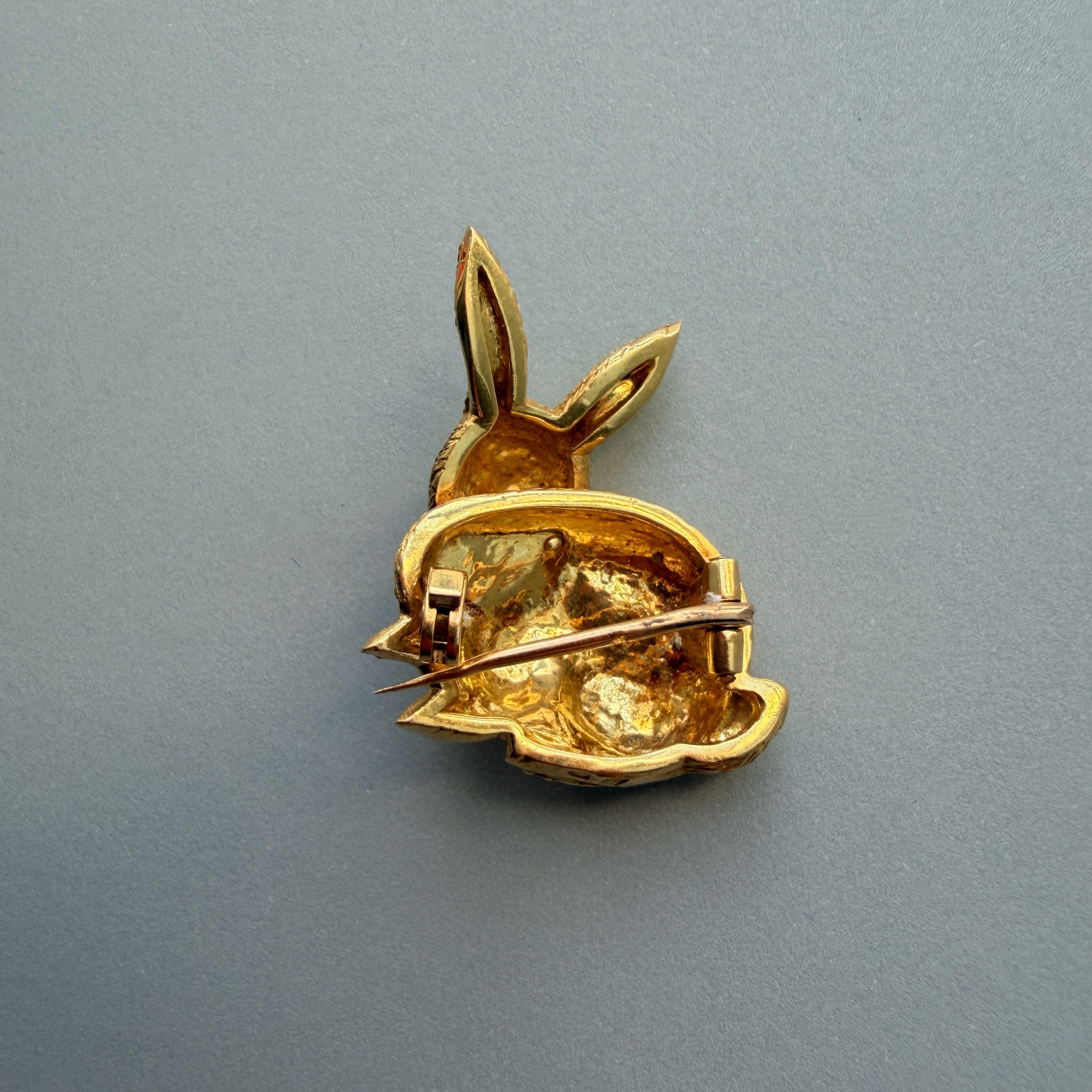 18k yellow gold rabbit brooch with ruby eyes