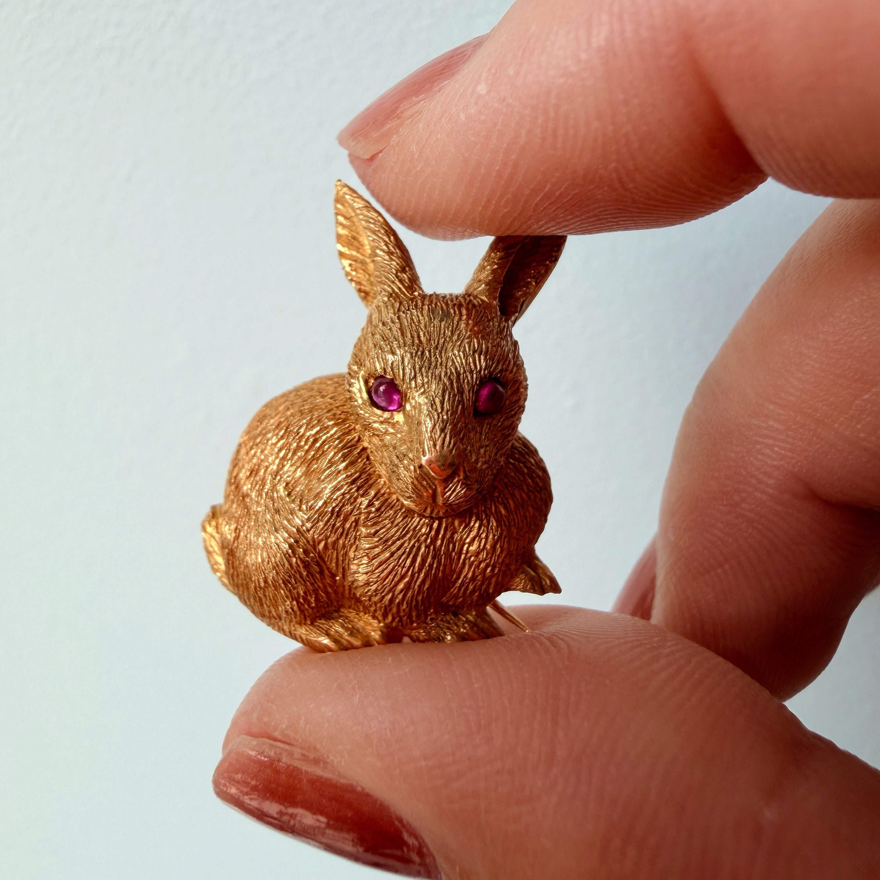 18k yellow gold rabbit brooch with ruby eyes