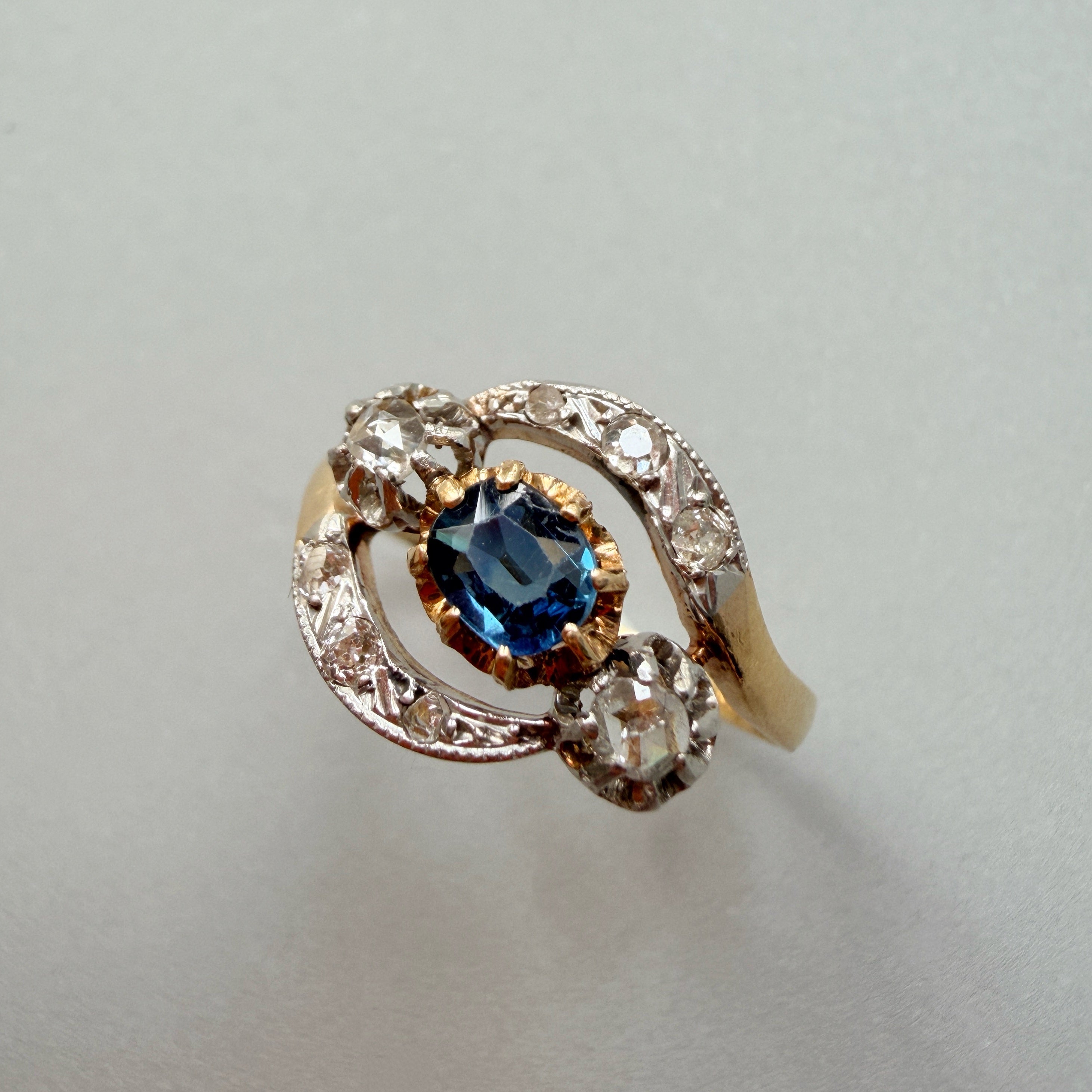 Antique 18K gold blue sapphire diamond tourbillon ring