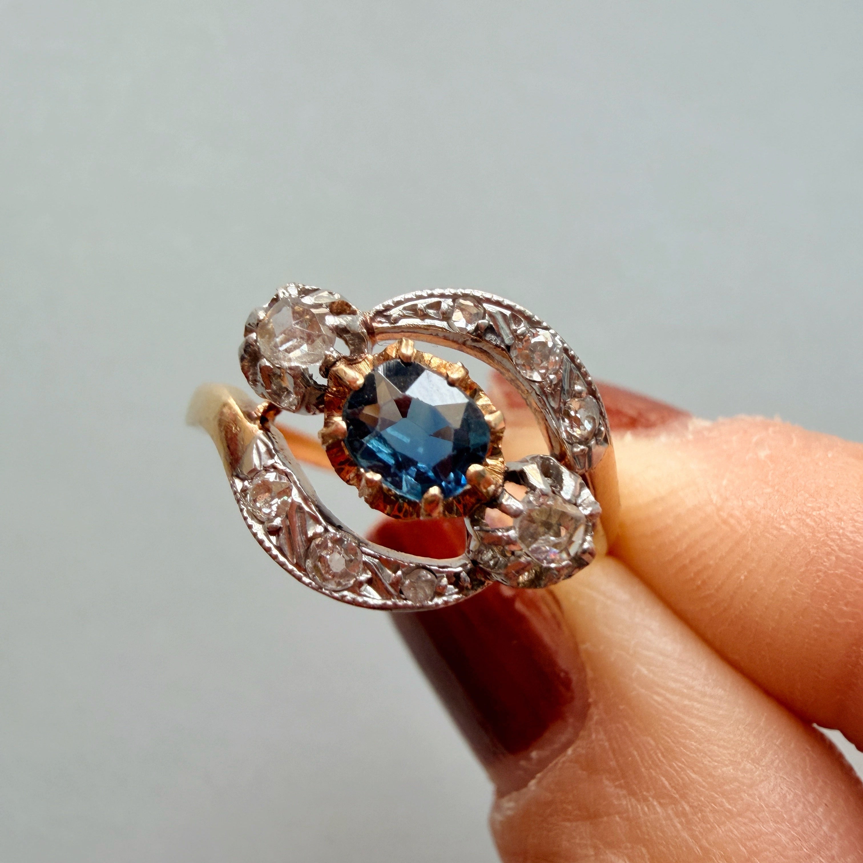 Antique 18K gold blue sapphire diamond tourbillon ring