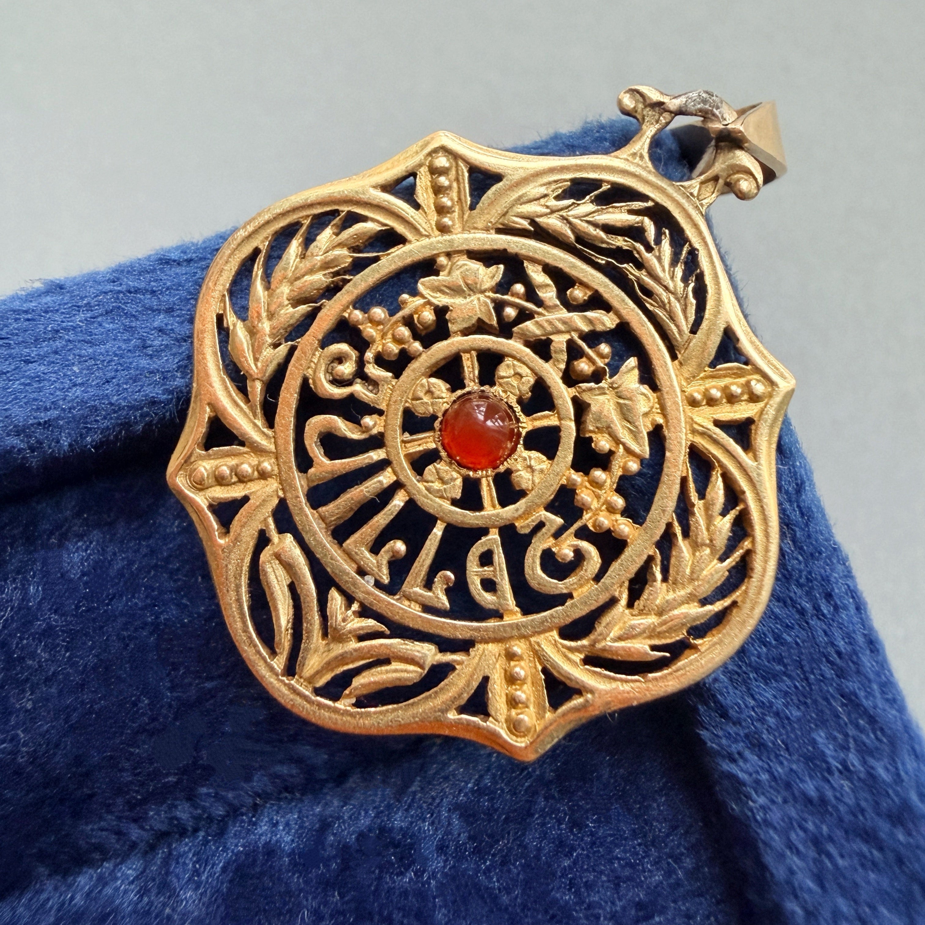 Art Nouveau era 18K gold “July” medal pendant
