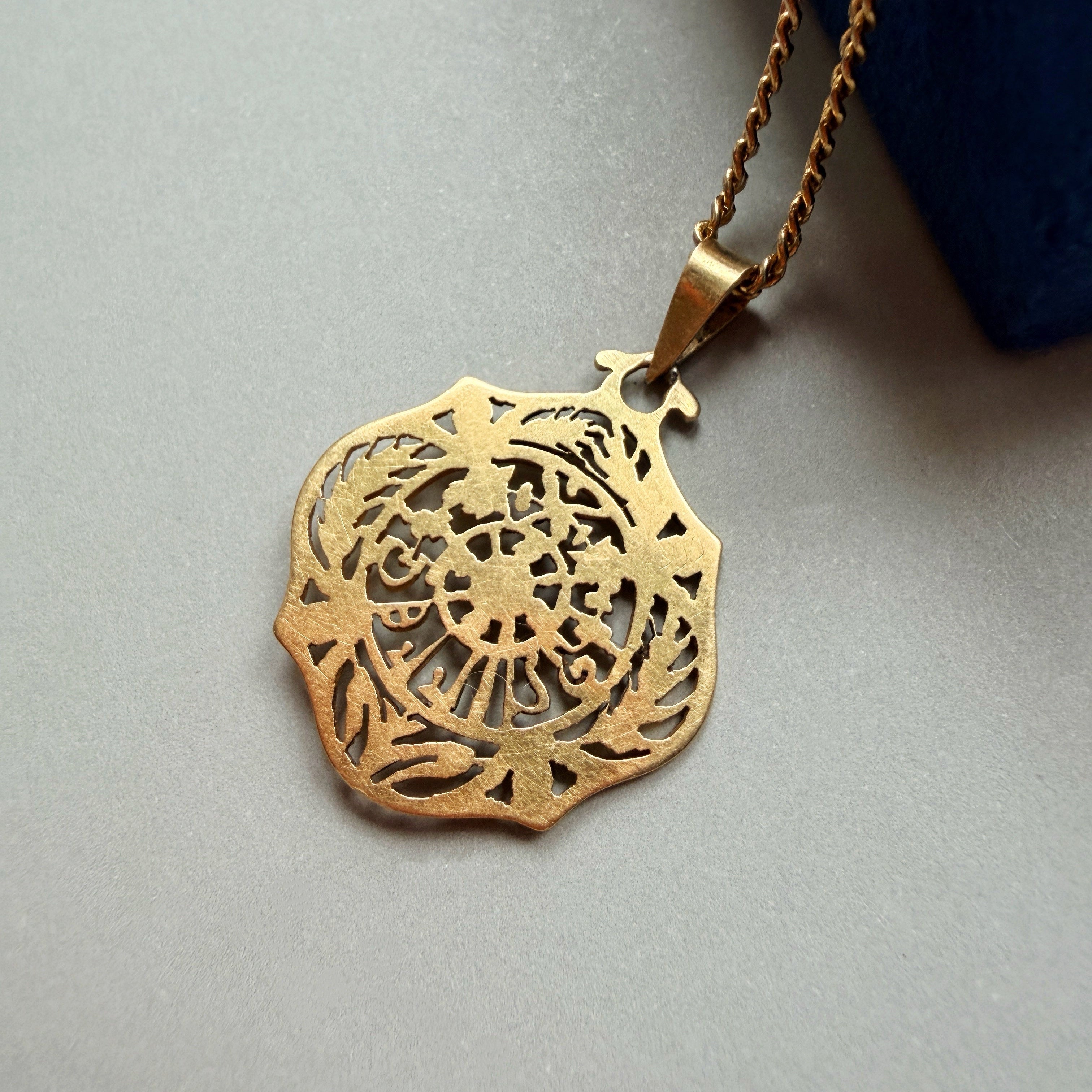 Art Nouveau era 18K gold “July” medal pendant
