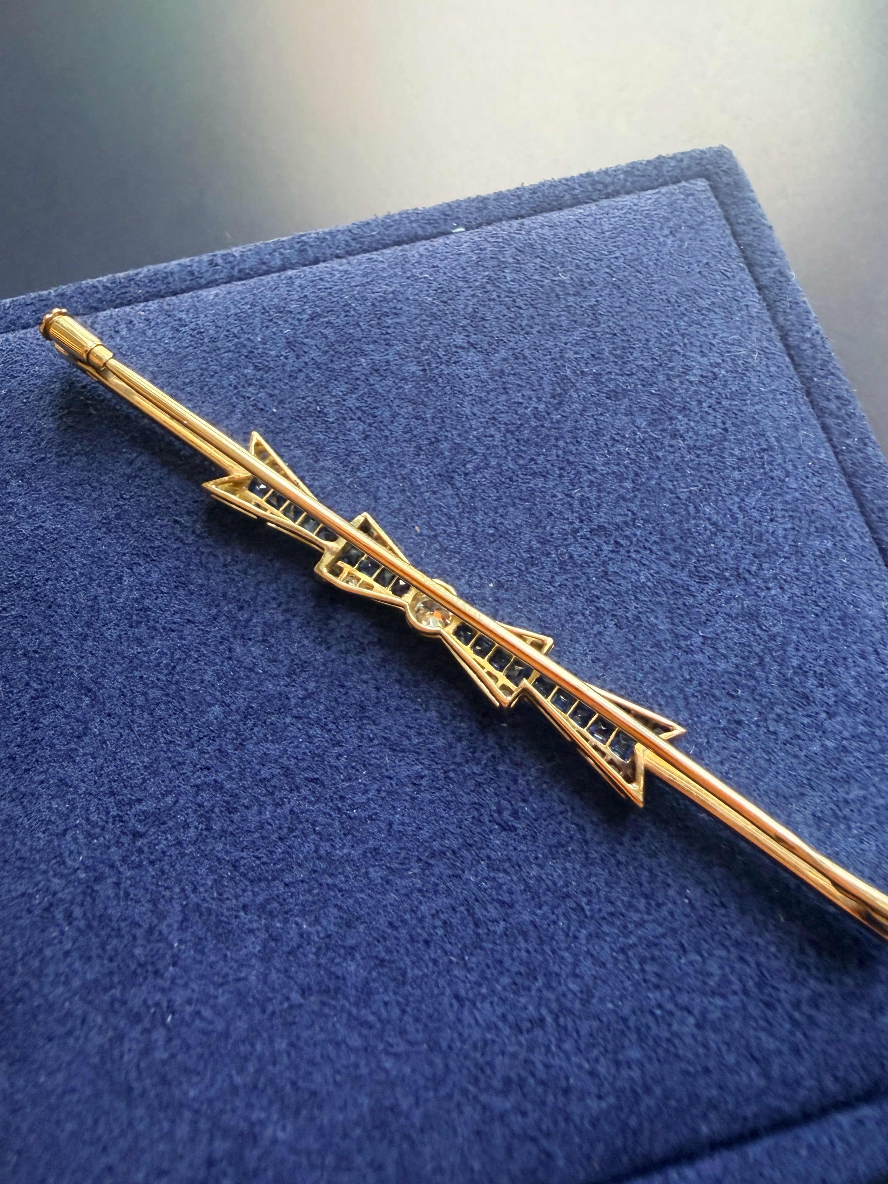 Art Deco 18K gold diamond sapphire bow brooch