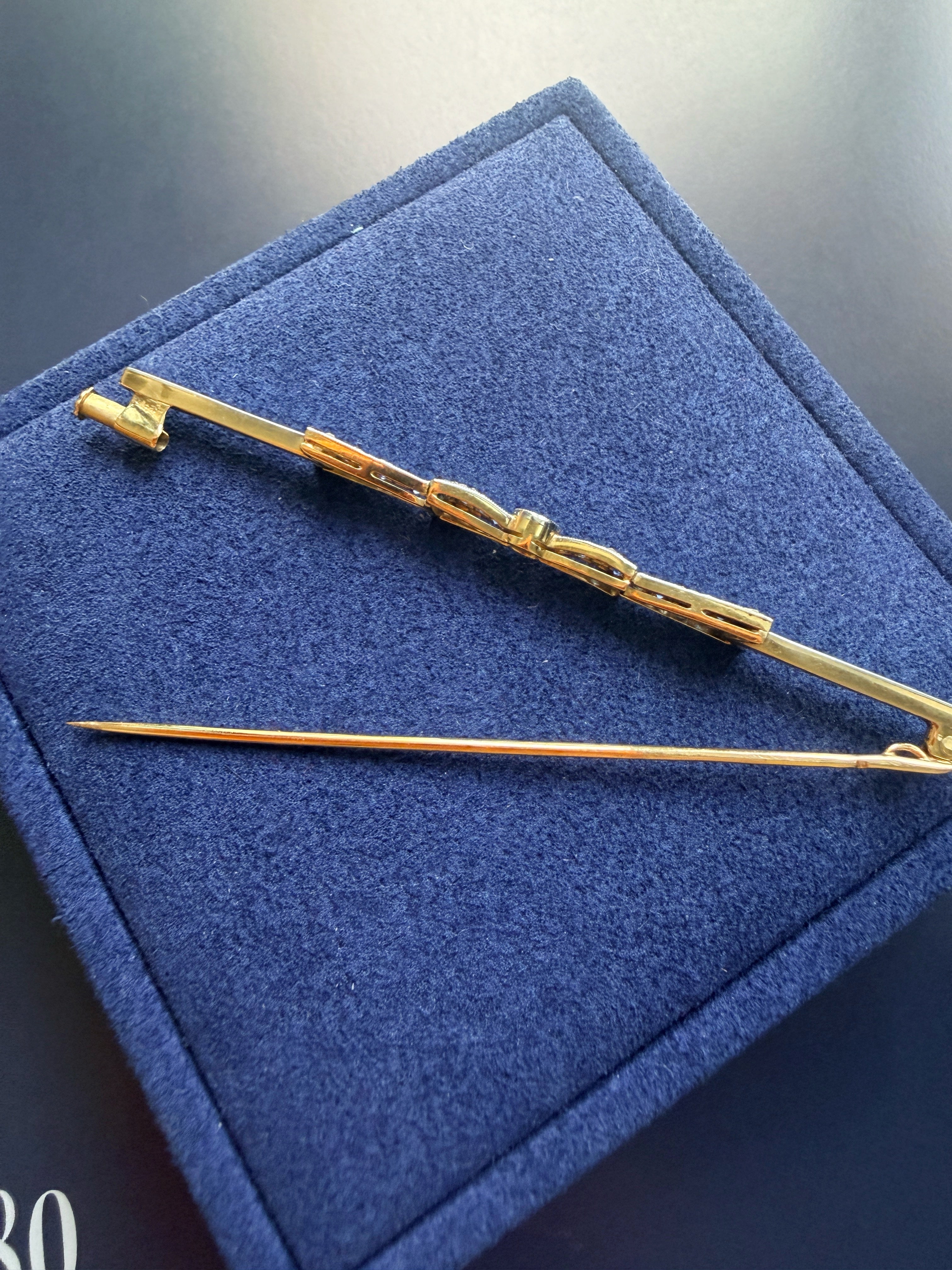 Art Deco 18K gold diamond sapphire bow brooch