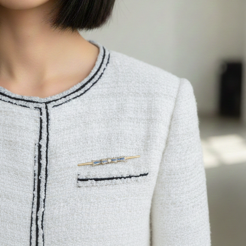 Art Deco 18K gold diamond sapphire bow brooch