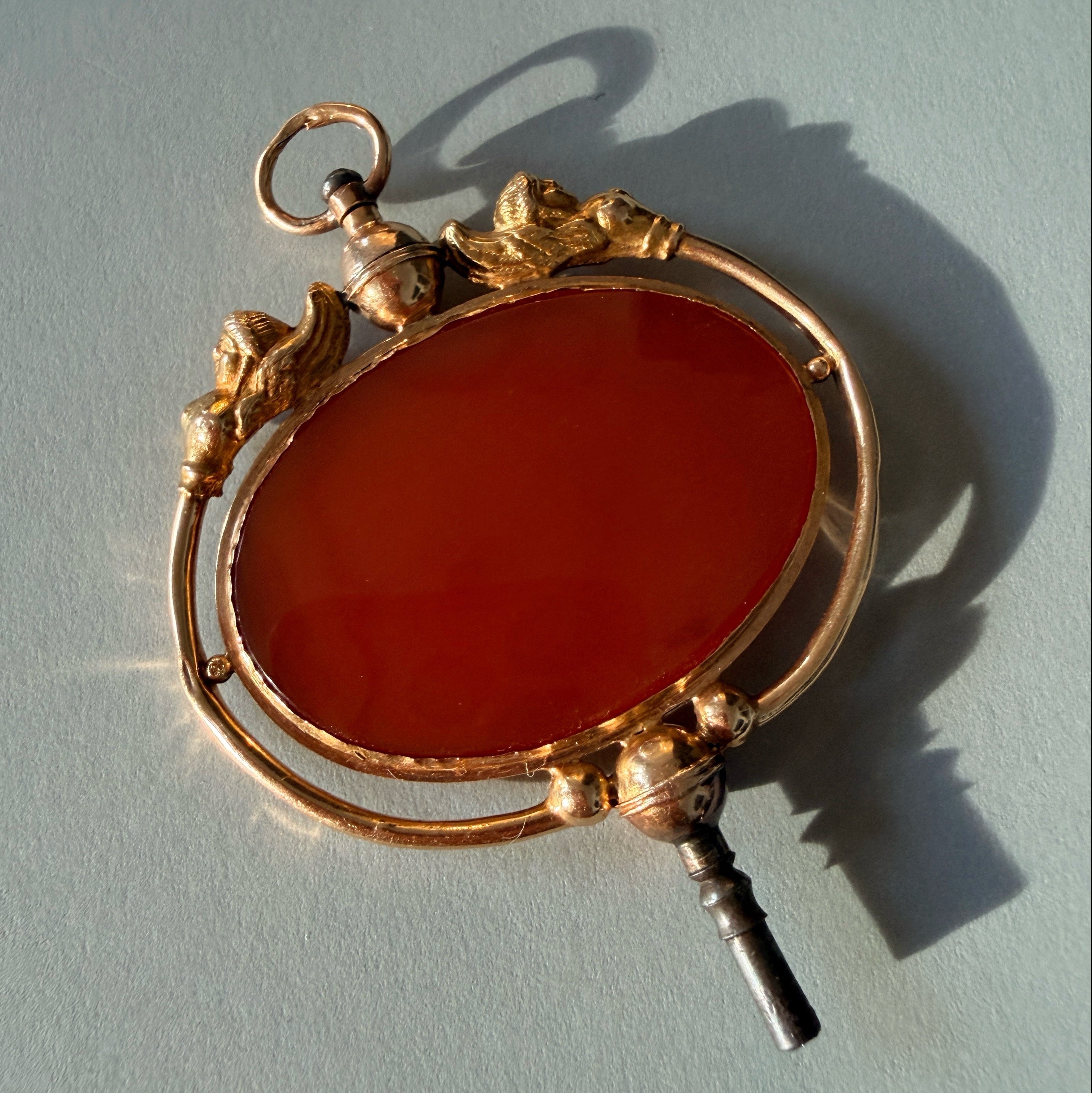 Victorian era 18K gold Egyptomania cornelian watch key pendant