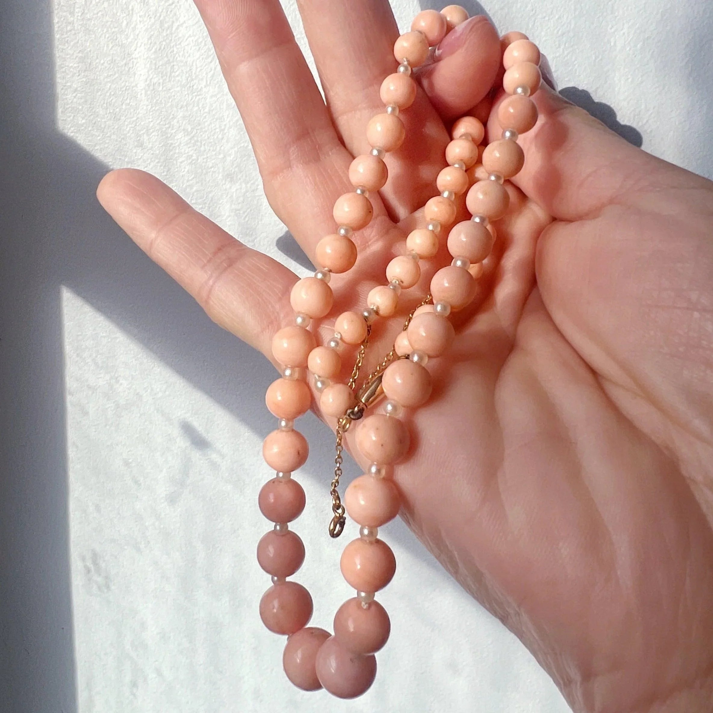 18K gold graduated natural angel skin pink coral pearl necklace - Curiously timeless