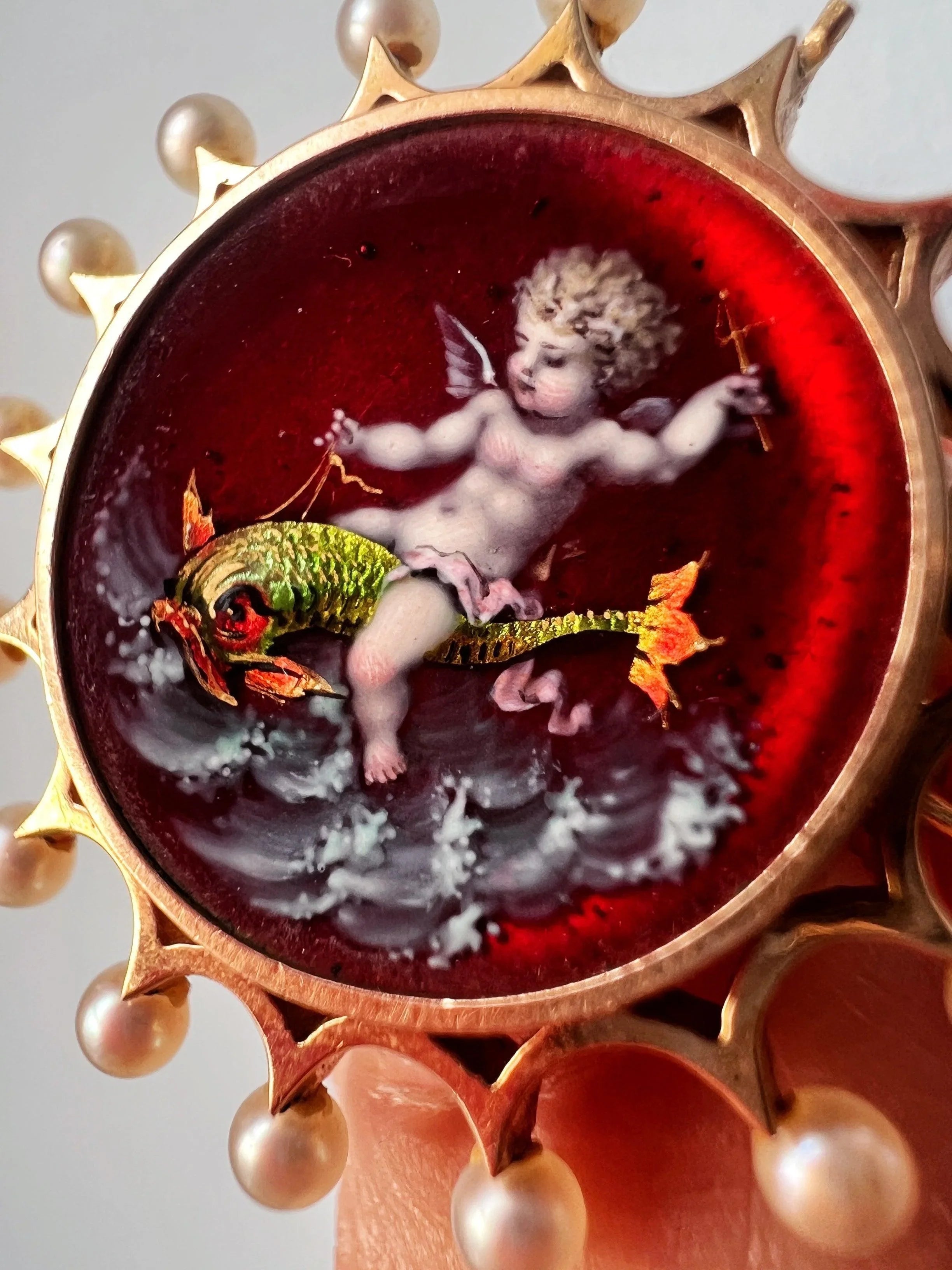 Victorian era 18K gold pearl enamel cupid riding a dolphin brooch - Curiously timeless