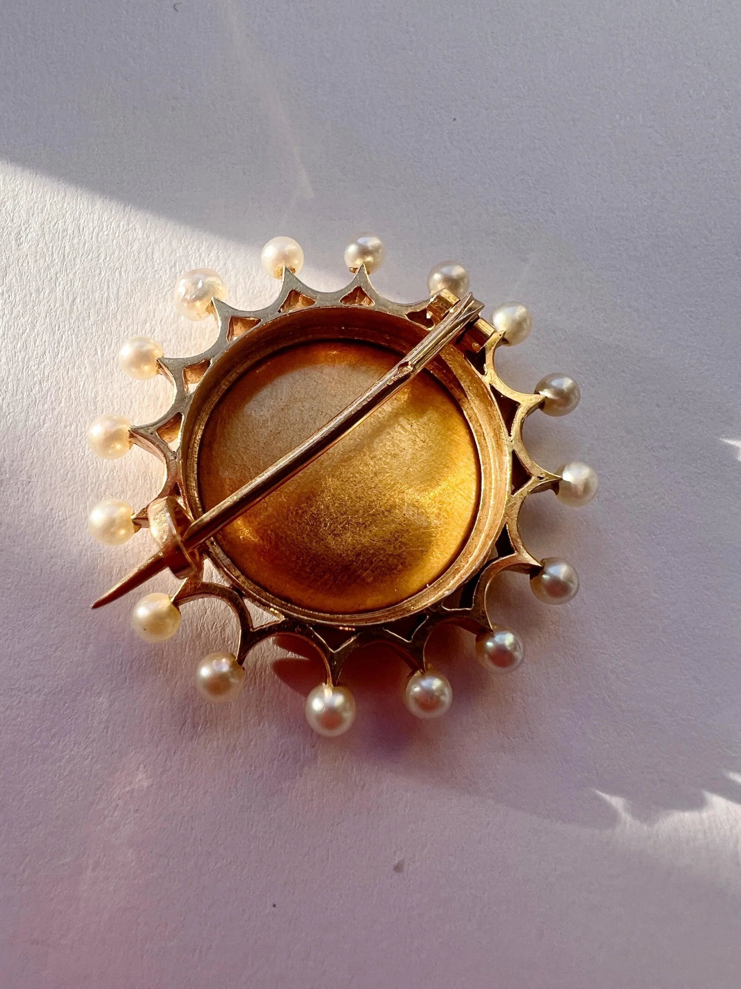 Victorian era 18K gold pearl enamel cupid riding a dolphin brooch - Curiously timeless