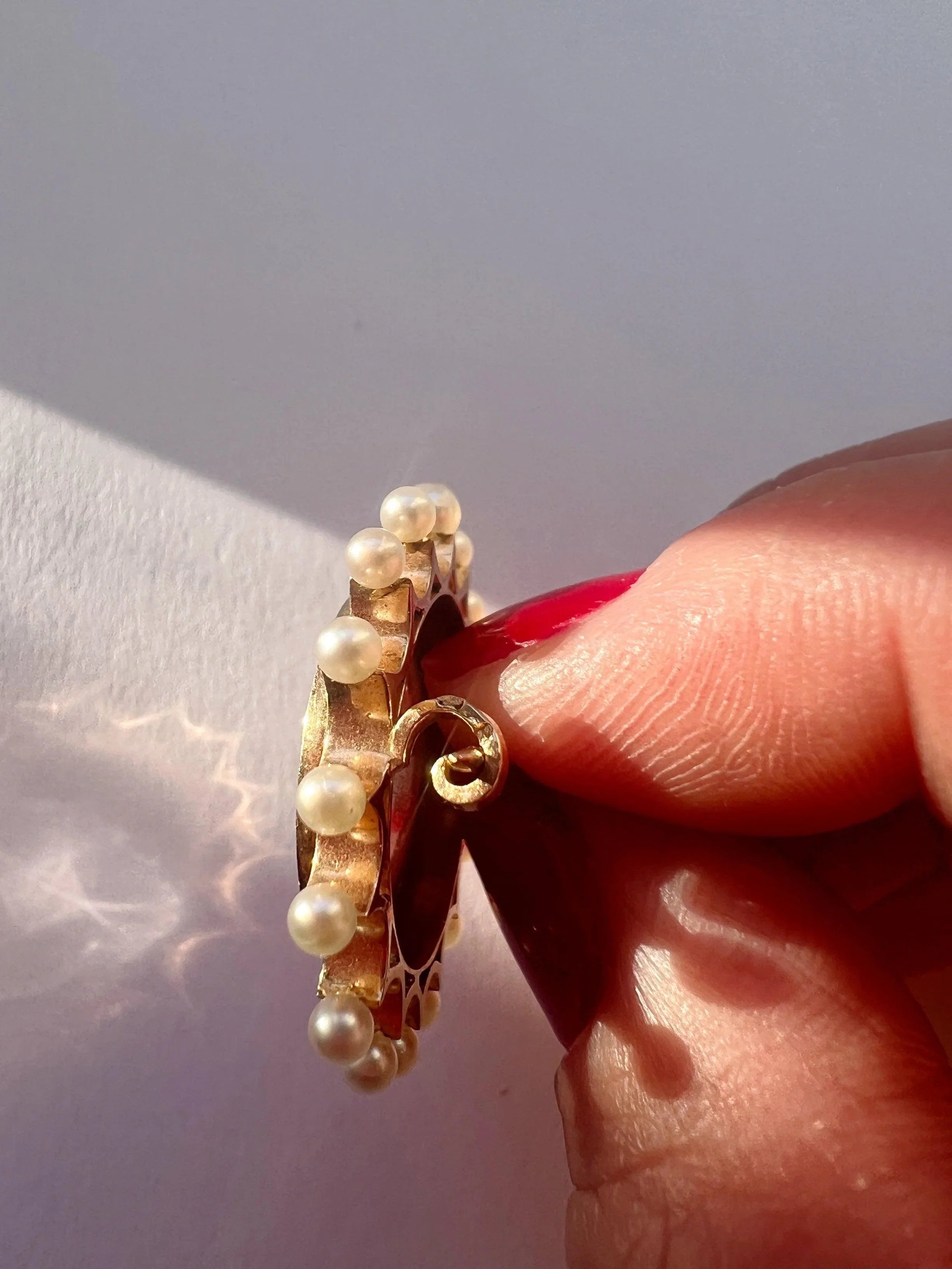 Victorian era 18K gold pearl enamel cupid riding a dolphin brooch - Curiously timeless