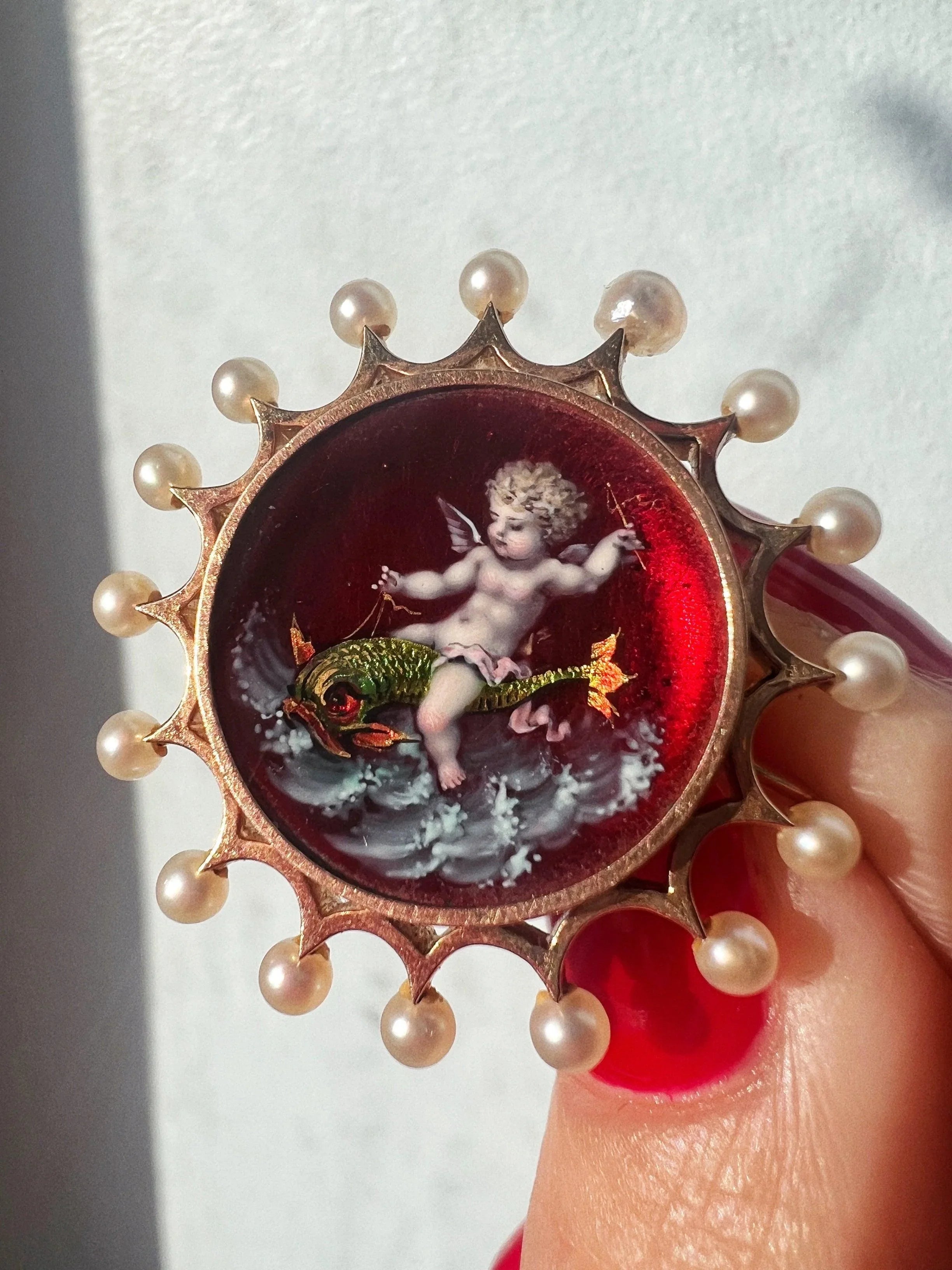 Victorian era 18K gold pearl enamel cupid riding a dolphin brooch - Curiously timeless
