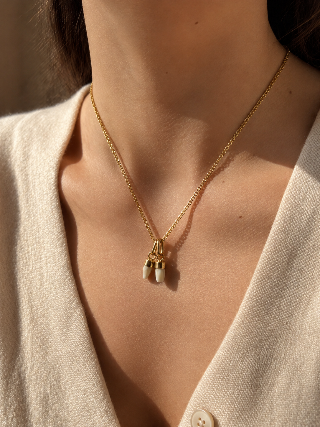Pair of 2 Antique 18K gold milk teeth pendant