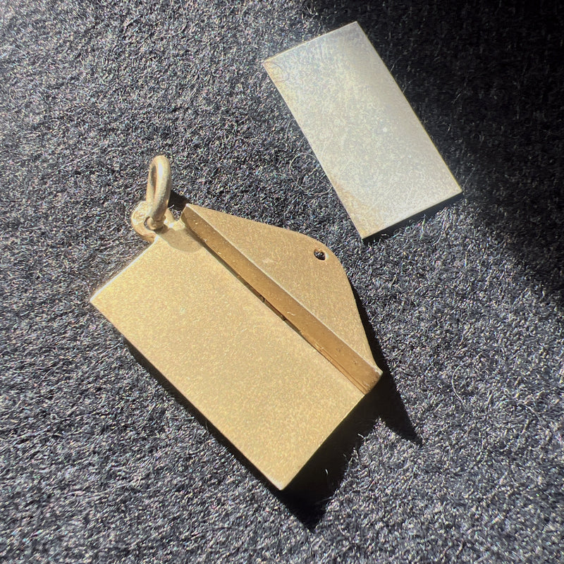 Antique silver envelope with a letter charm pendant