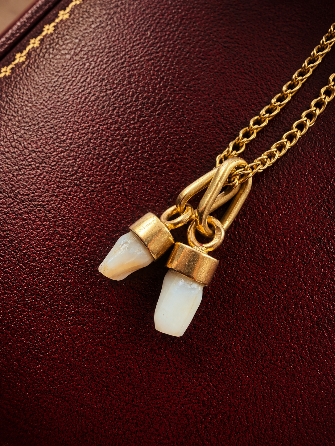 Pair of 2 Antique 18K gold milk teeth pendant