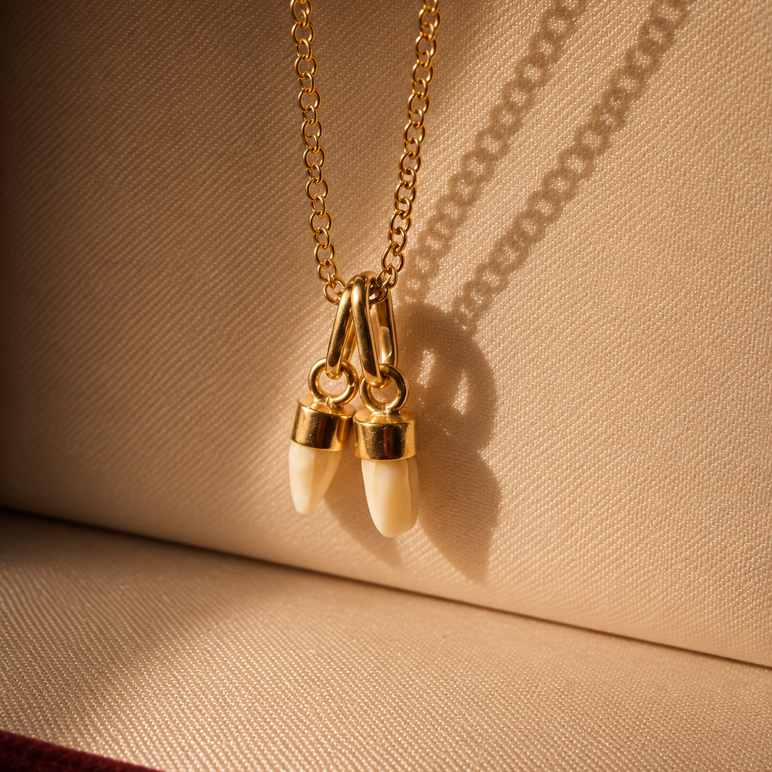 Pair of 2 Antique 18K gold milk teeth pendant