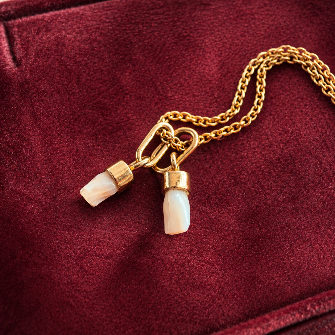 Pair of 2 Antique 18K gold milk teeth pendant