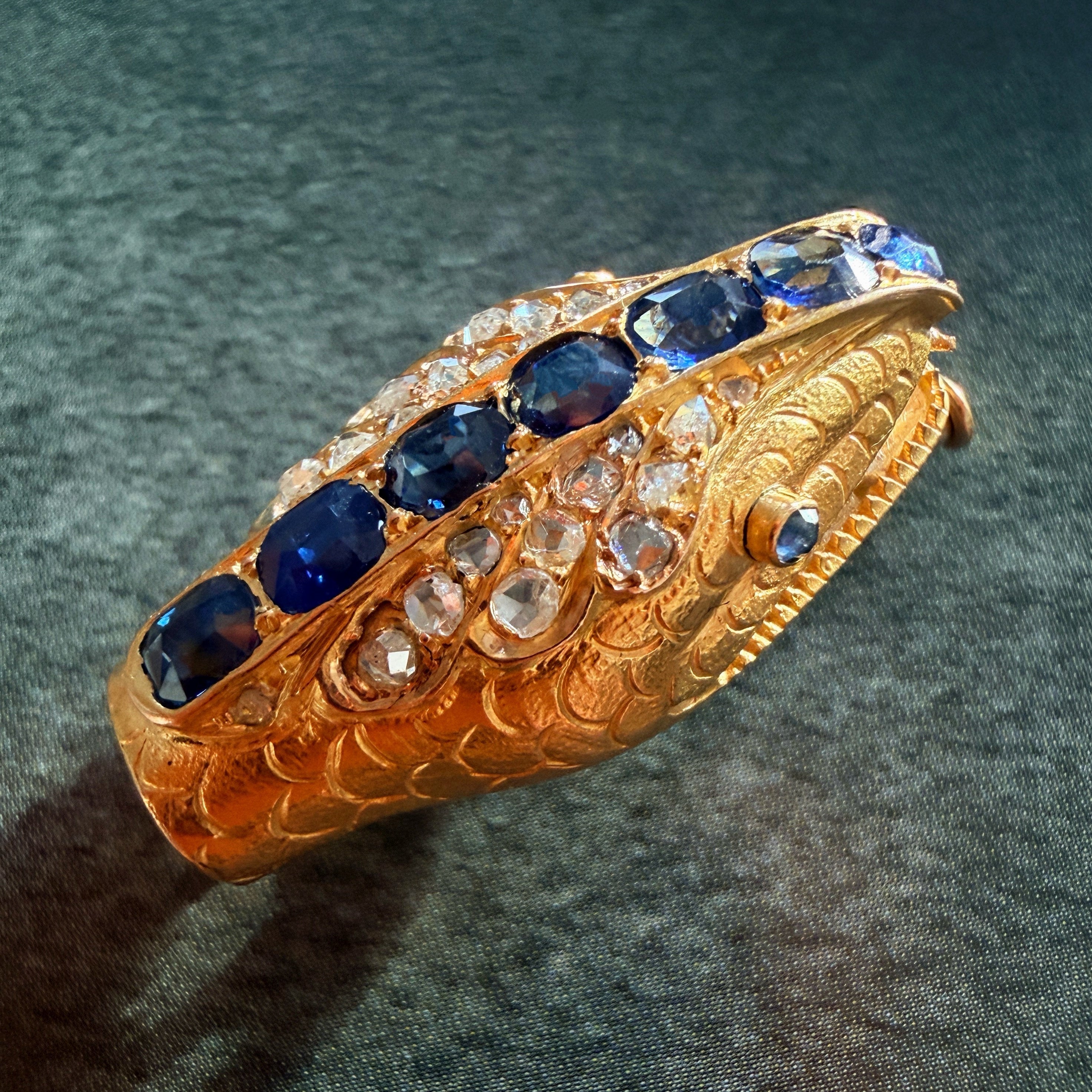 Antique 18K gold blue sapphire diamond snake head brooch