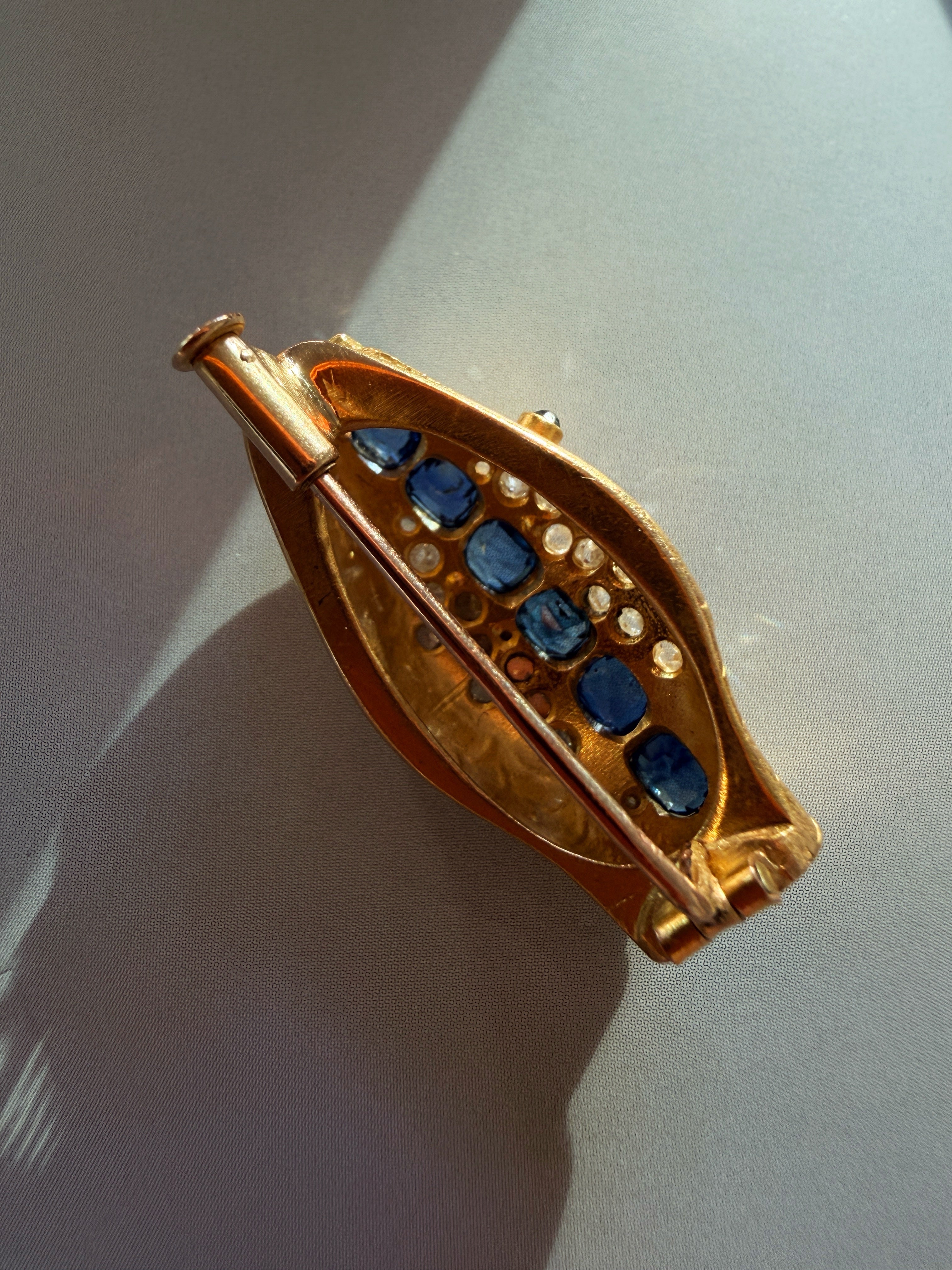 Antique 18K gold blue sapphire diamond snake head brooch