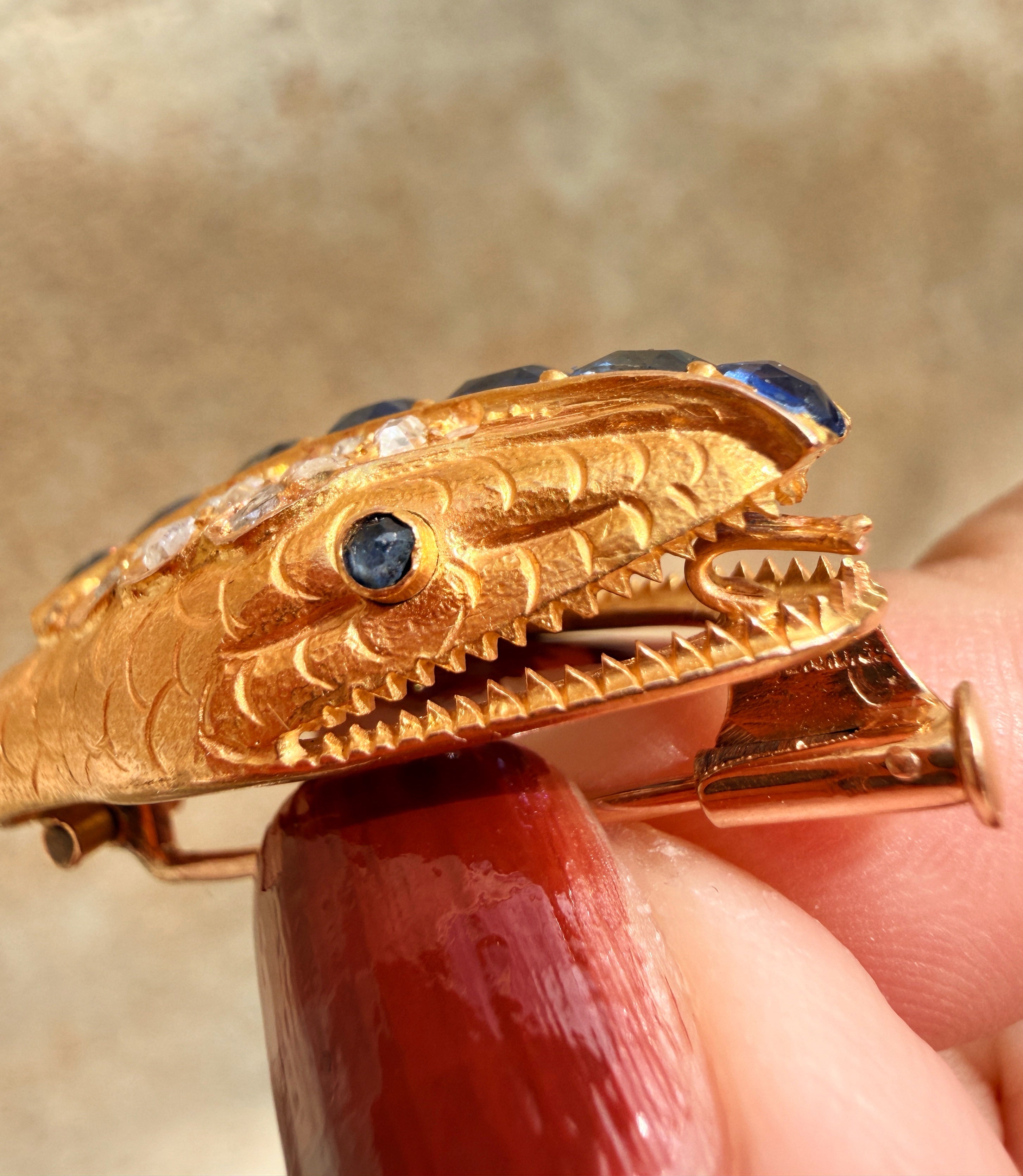 Antique 18K gold blue sapphire diamond snake head brooch