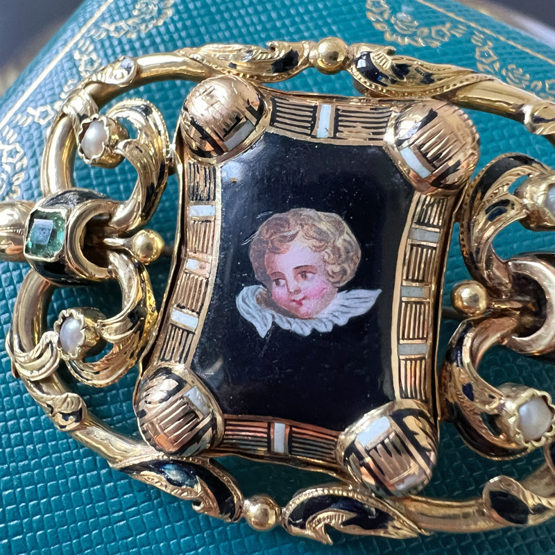 Antique 18K gold cherub brooch with emeralds and natural pearls