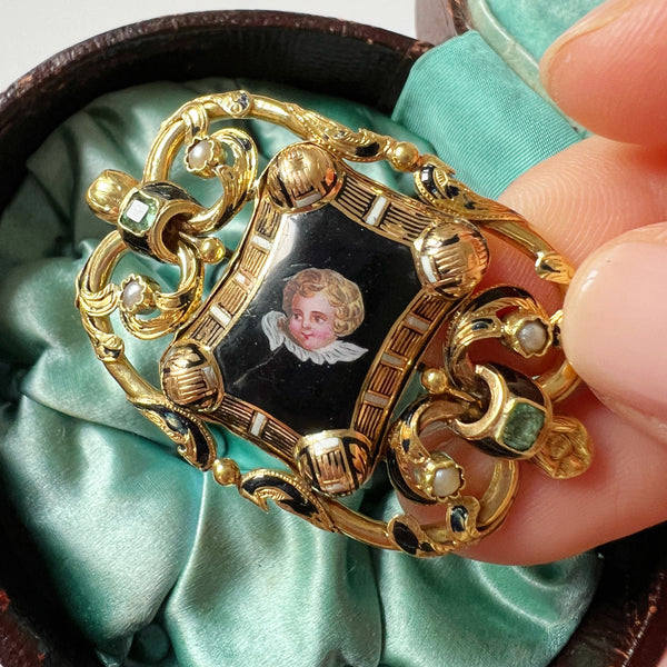 Antique 18K gold cherub brooch with emeralds and natural pearls