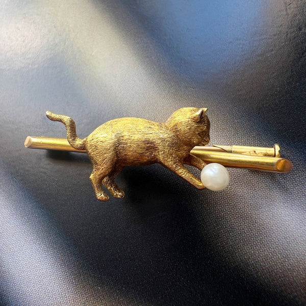 Antique 18K gold cat chasing a pearl ball brooch