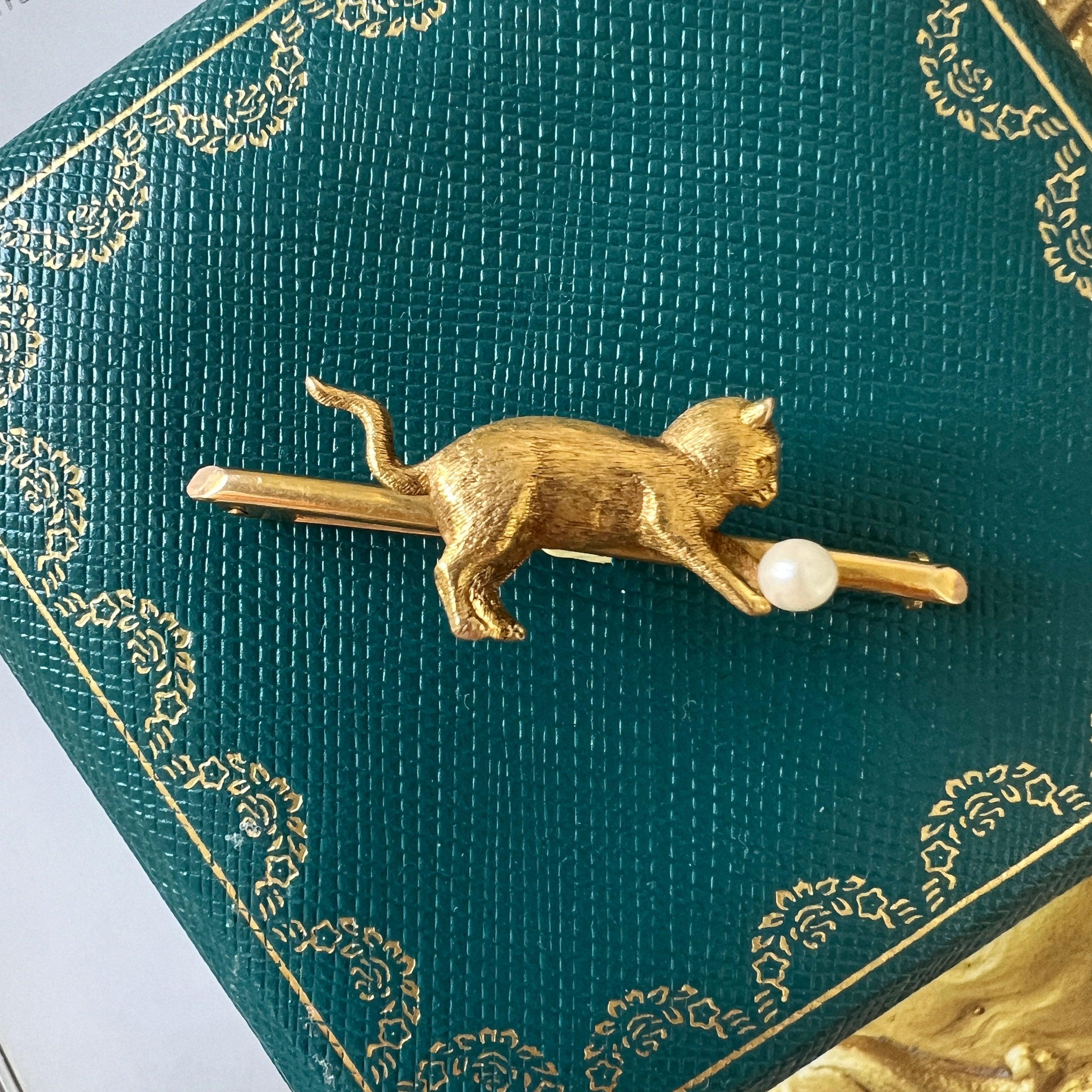 Antique 18K gold cat chasing a pearl ball brooch - Curiously timeless