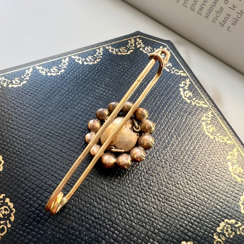 Gold flower brooch