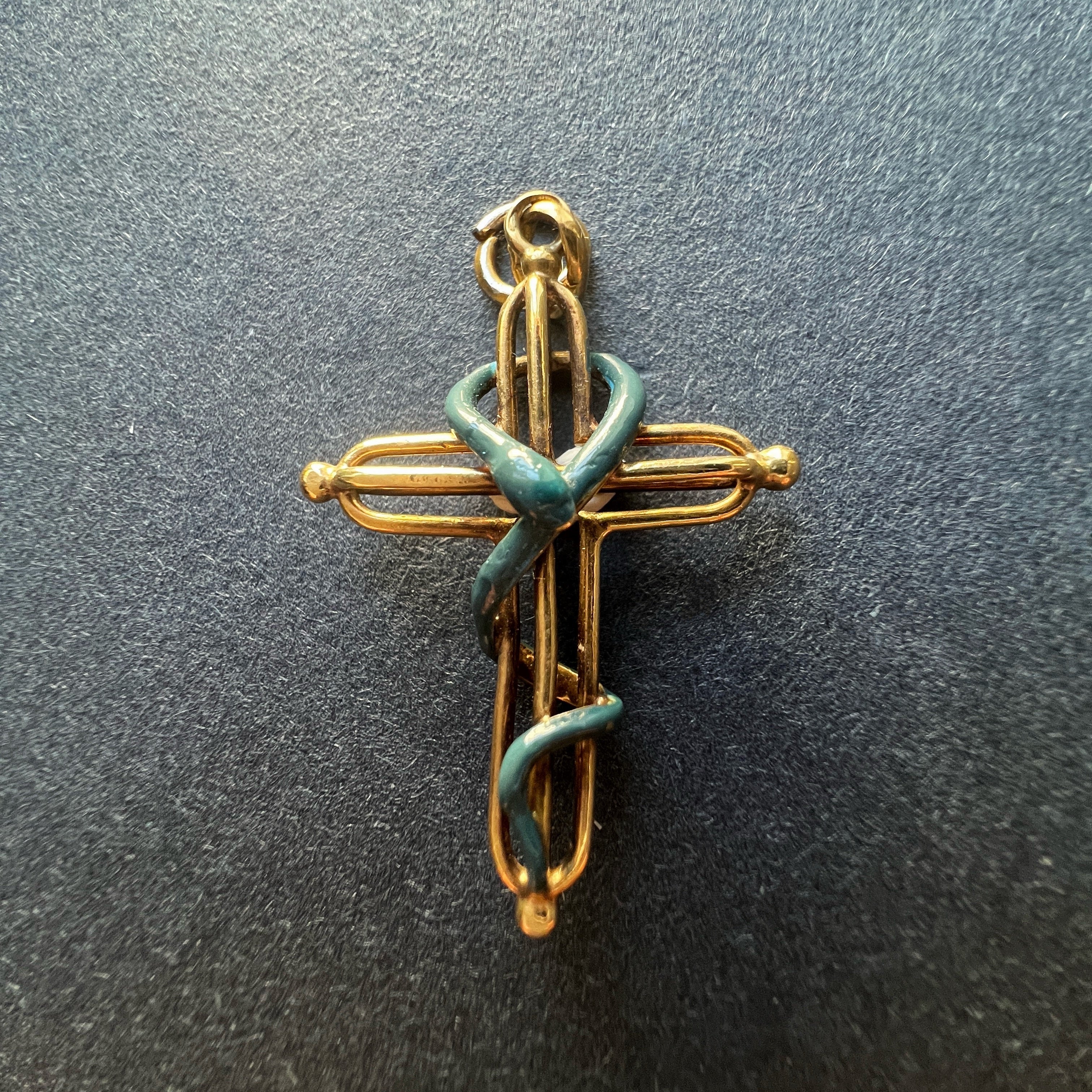Victorian era 18K gold snake over a cross pendant