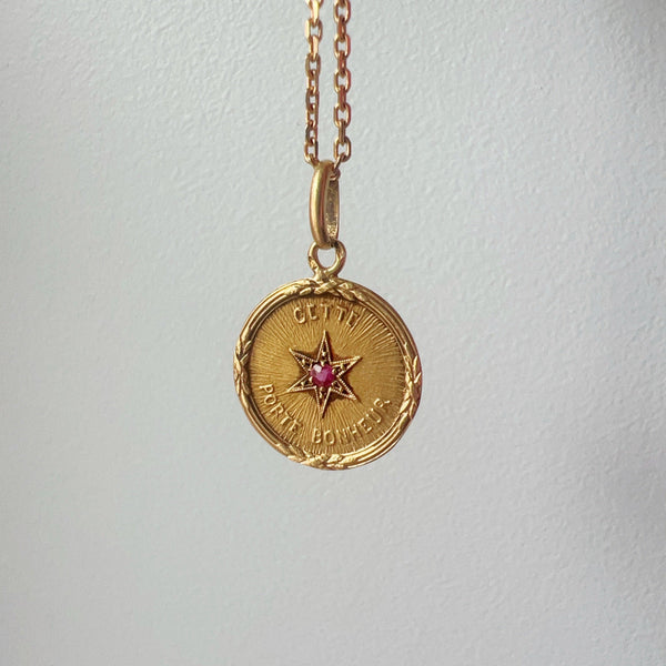 Rare French antique 18K ruby star medal pendant “this star brings happiness” - Curiously timeless