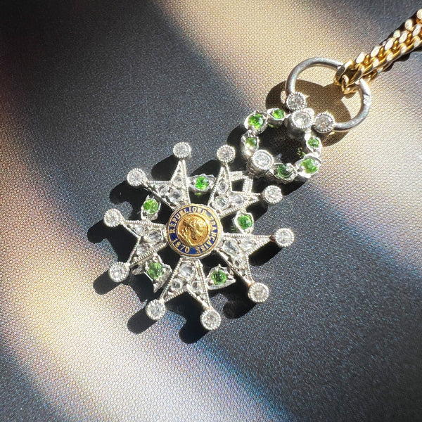 Platinum legion of honor pendant with diamond and tsavorite garnets