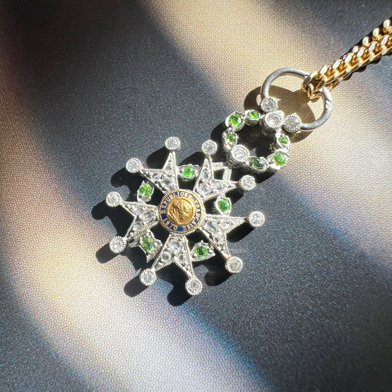 Platinum legion of honor pendant with diamond and tsavorite garnets