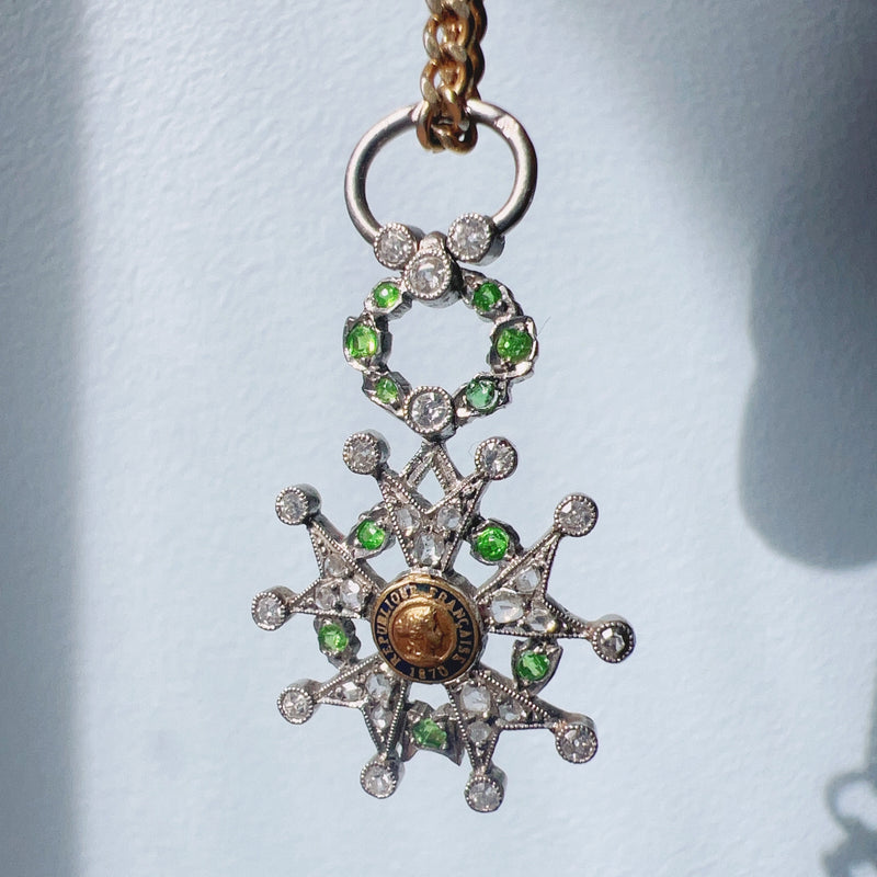 Platinum legion of honor pendant with diamond and tsavorite garnets