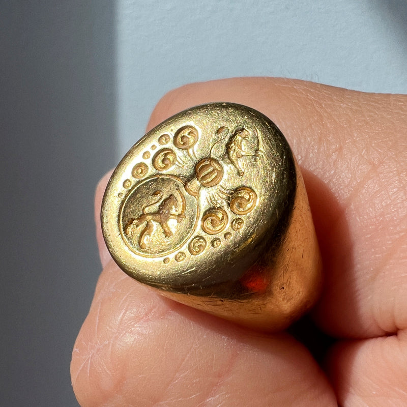 Antique 18K gold lion and sword signet ring