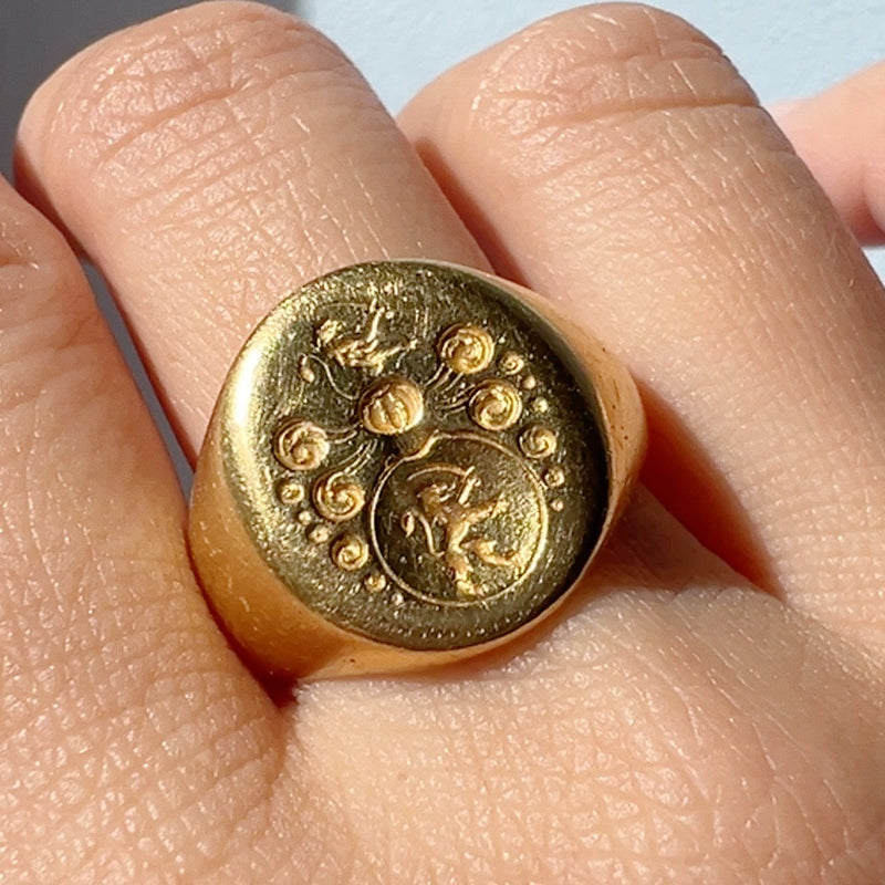 Antique 18K gold lion and sword signet ring