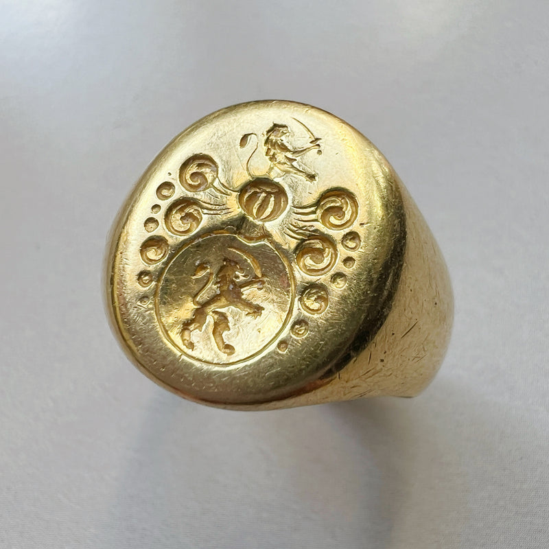 Antique 18K gold lion and sword signet ring