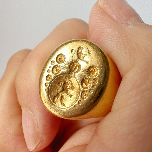 Antique 18K gold lion and sword signet ring