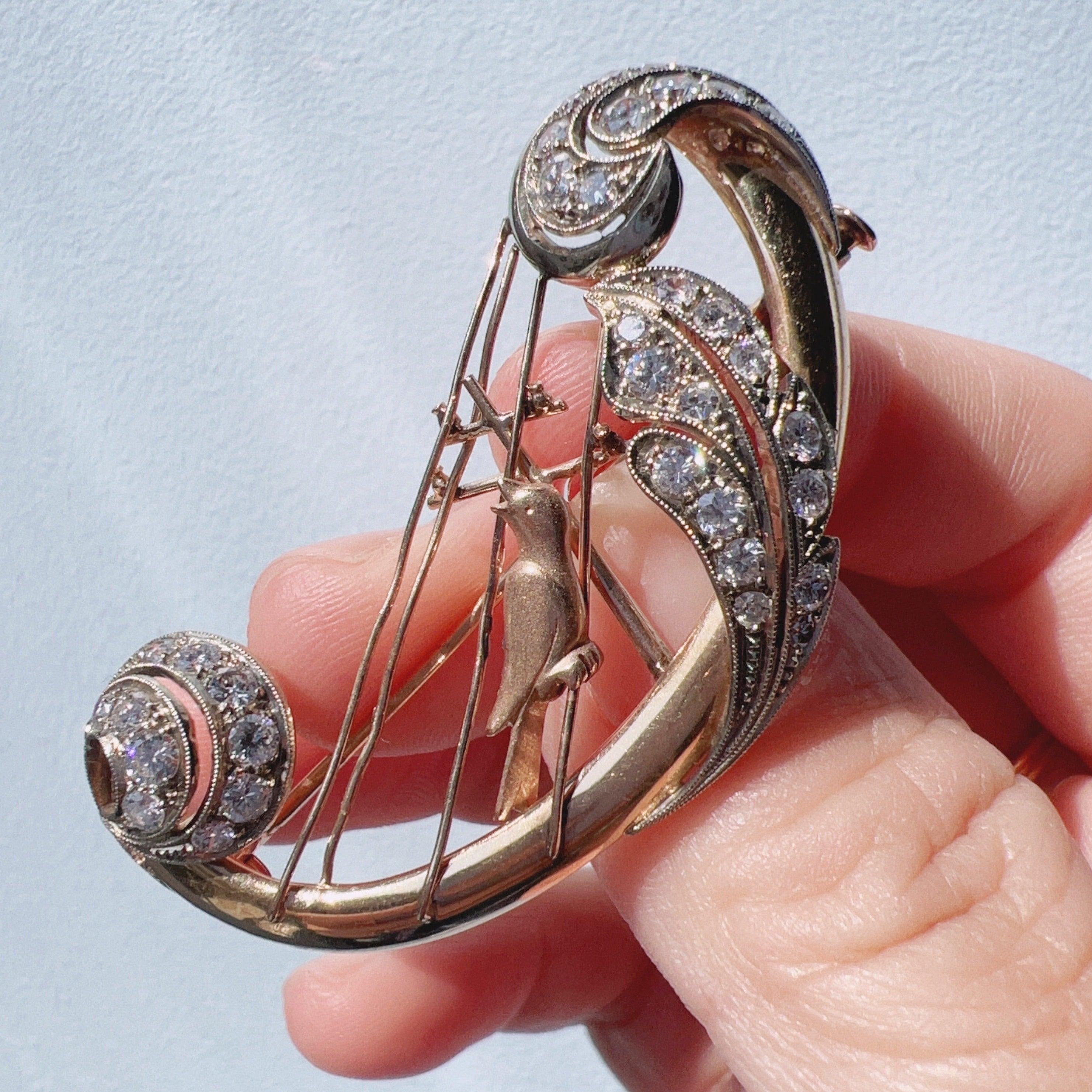 Vintage 18K gold diamond bird singing on a harp brooch - Curiously timeless