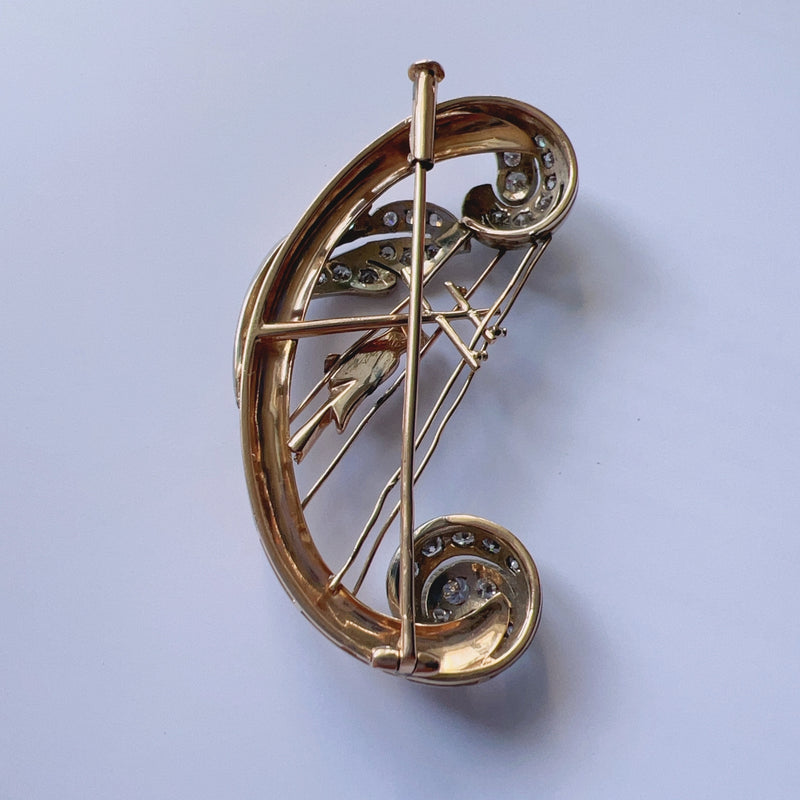 Vintage 18K gold diamond bird singing on a harp brooch