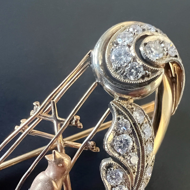 Vintage 18K gold diamond bird singing on a harp brooch